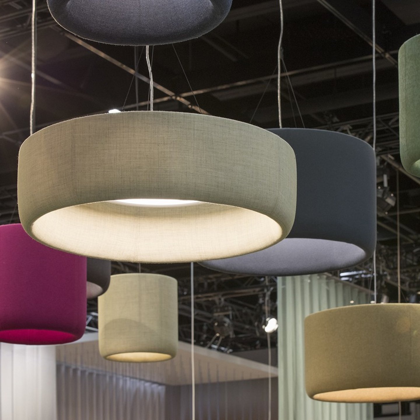 Haworth BuzziJet Lighting in multiple colors hanging from office space ceiling 