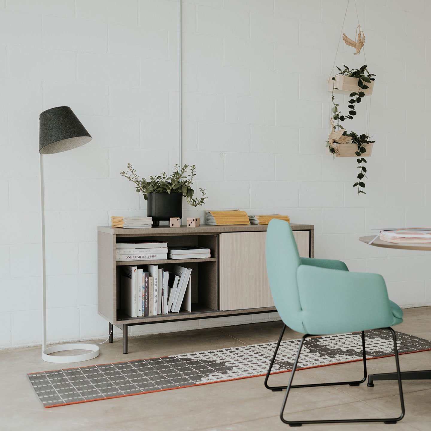 Haworth Lana Lighting Floor lamp in dark grey in private reading room with blue chair and circular table