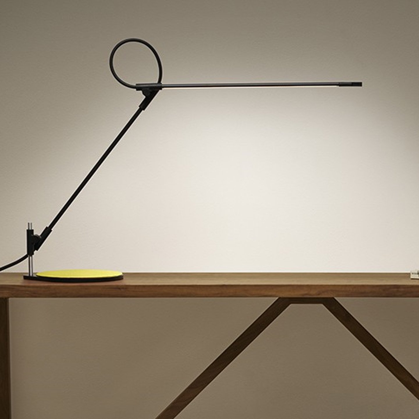 Haworth Superlight lighting in black color on wood desk 