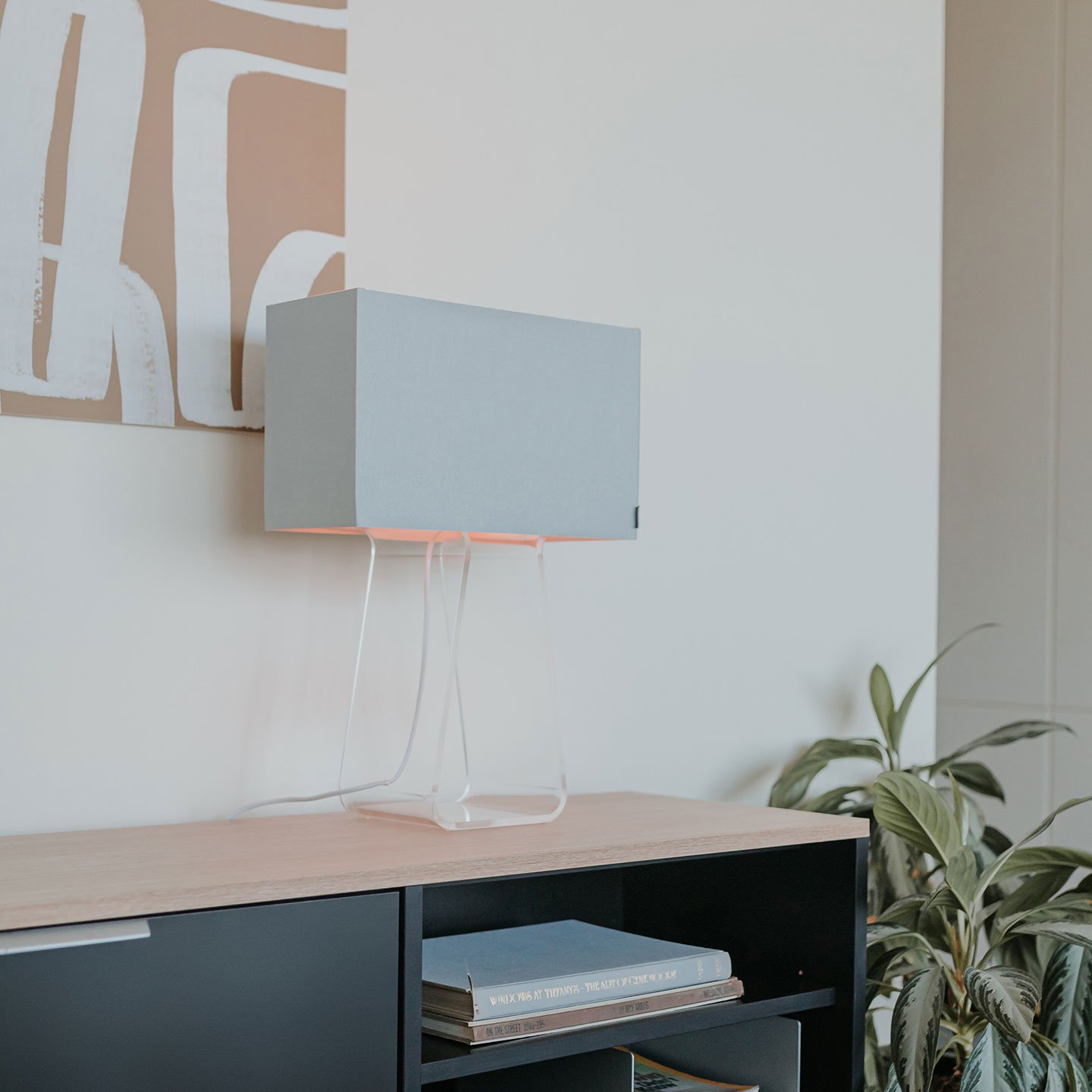 Haworth Tube Top Lighting in white lamp shade on office storage table