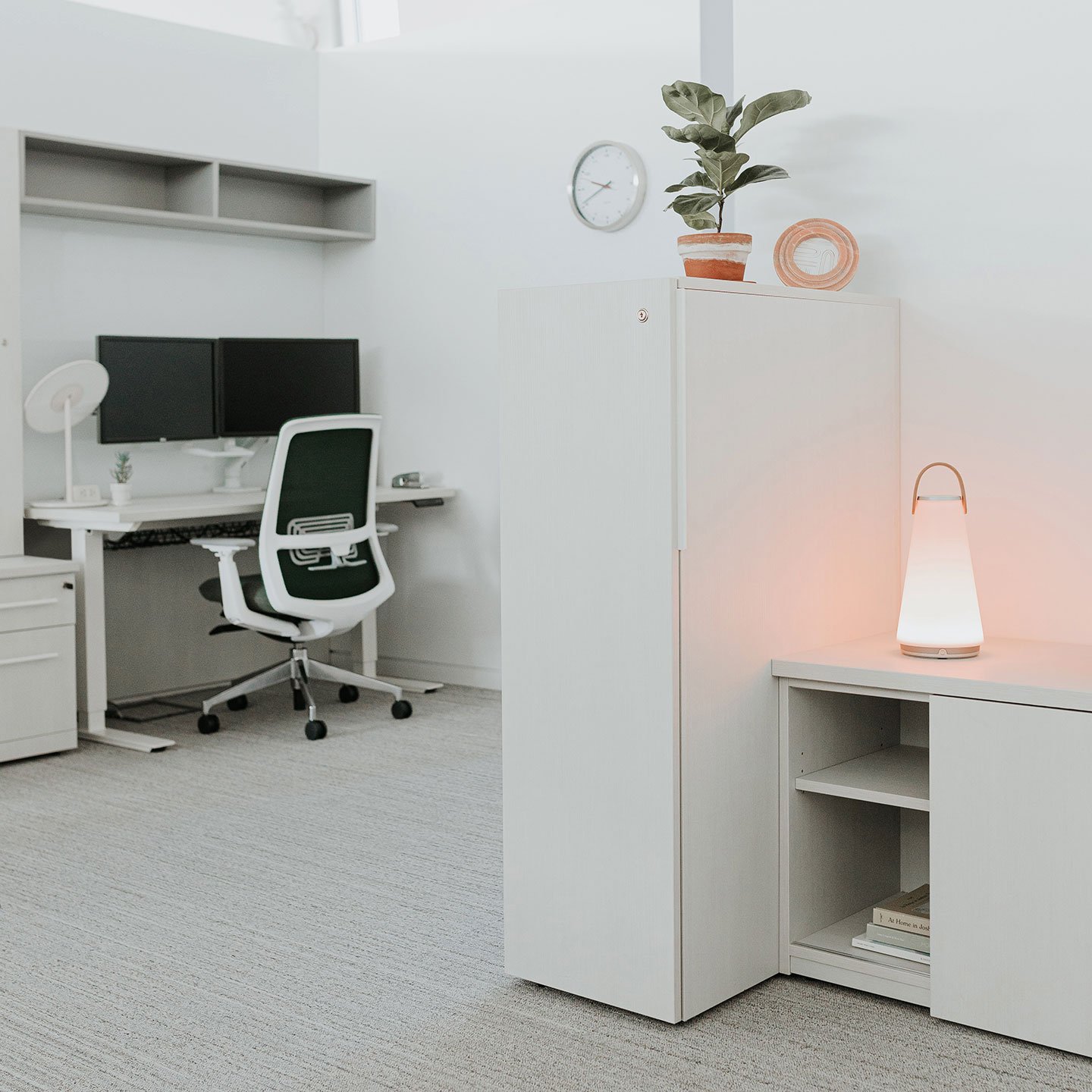 Haworth Uma Lighting in office space with white storage 