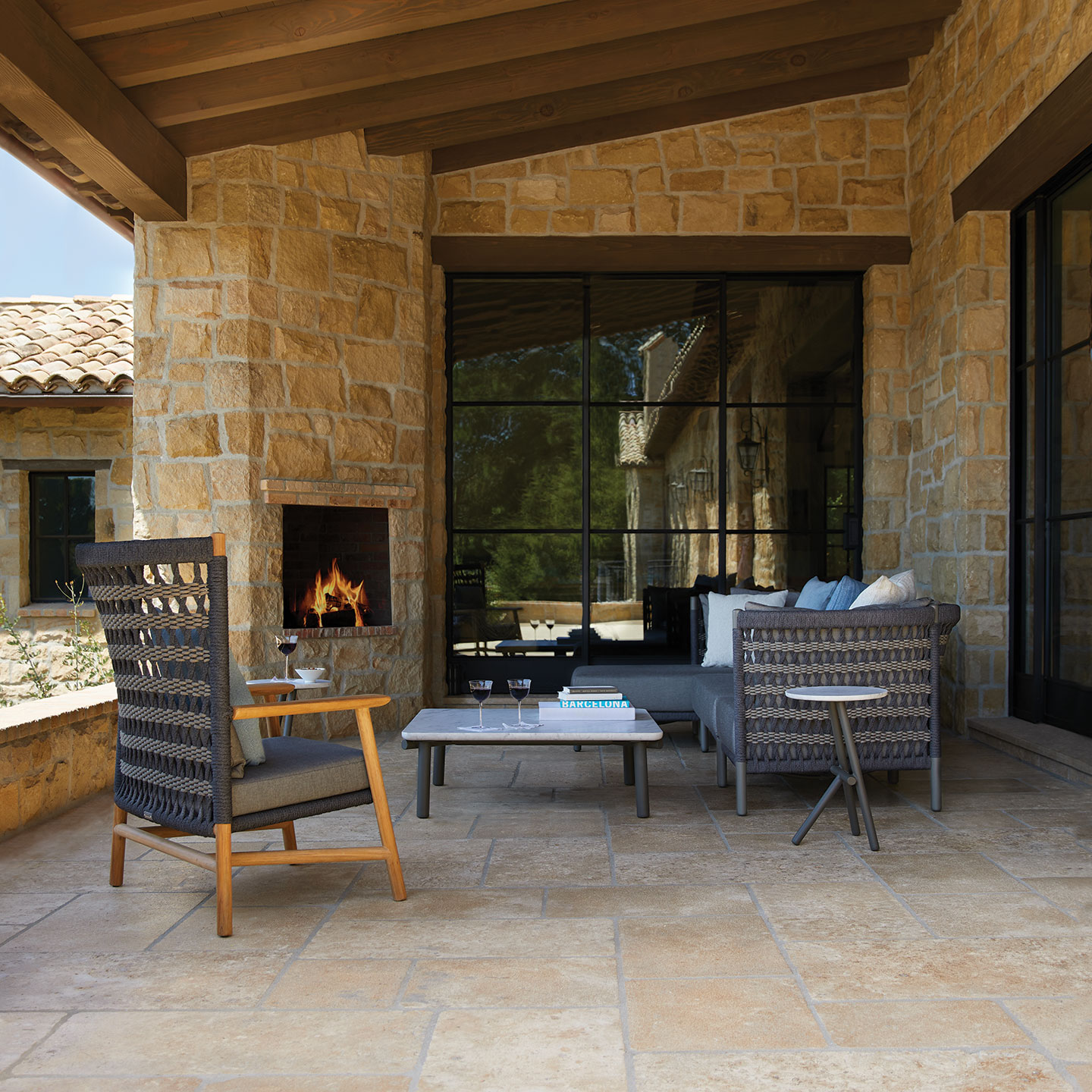 Haworth Anatra chairs in grey with woven back and wooden handles and legs in an outdoor space