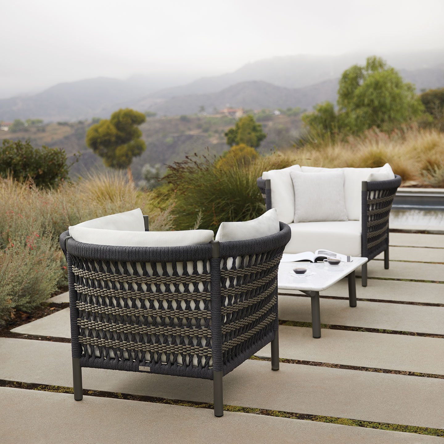 Haworth Anatra outdoor chair in brown cane and strings with white upholstery