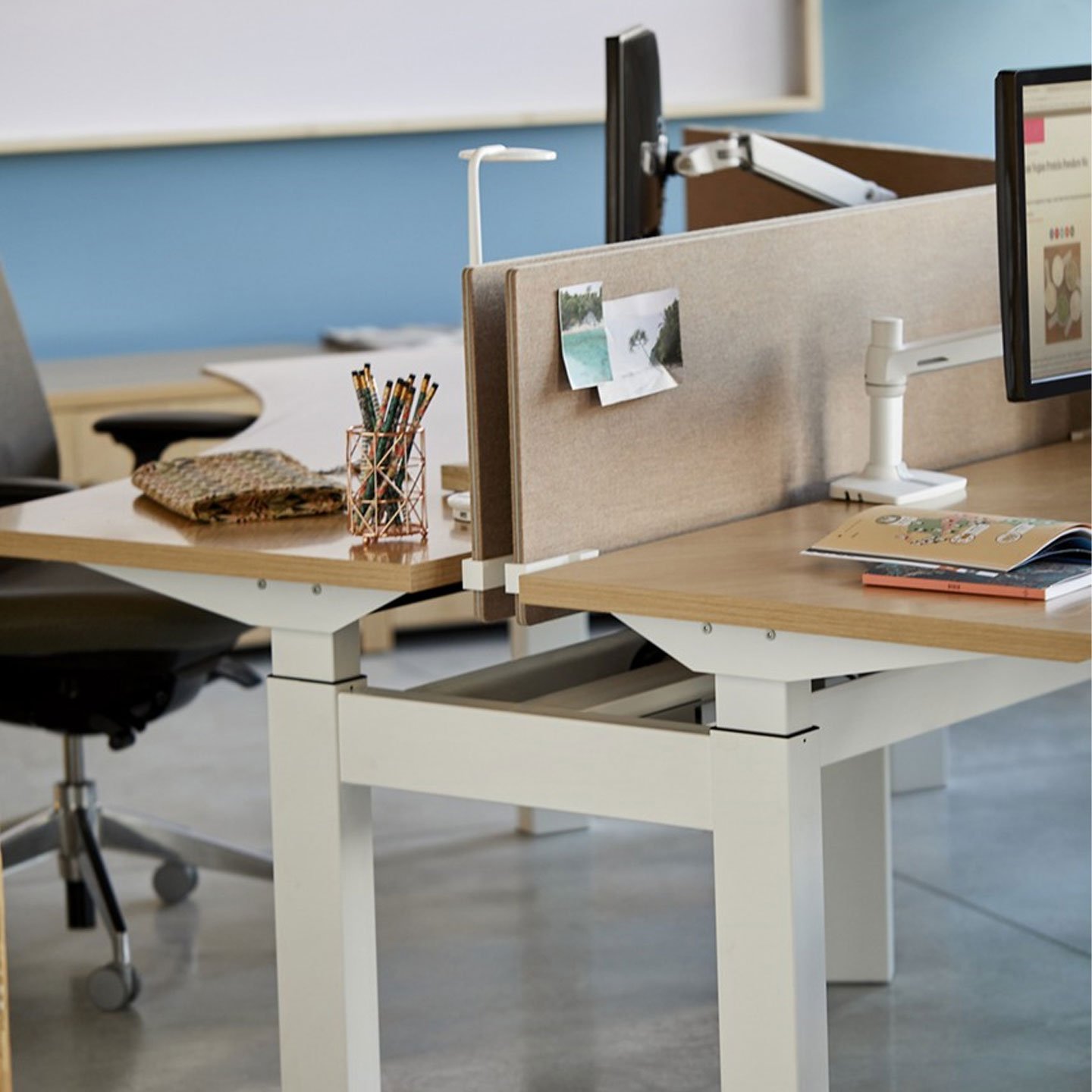 Haworth Belong Screen in etch brown color on office desk with monitor and keyboard on it