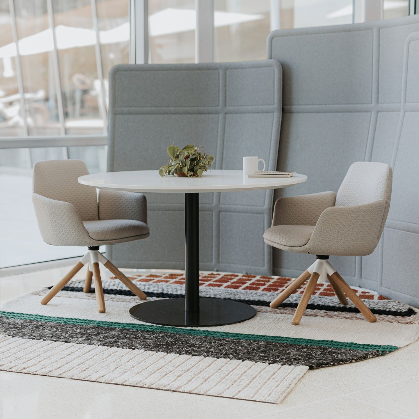 Haworth Openest Plume Screen in grey color with circular table in open office space