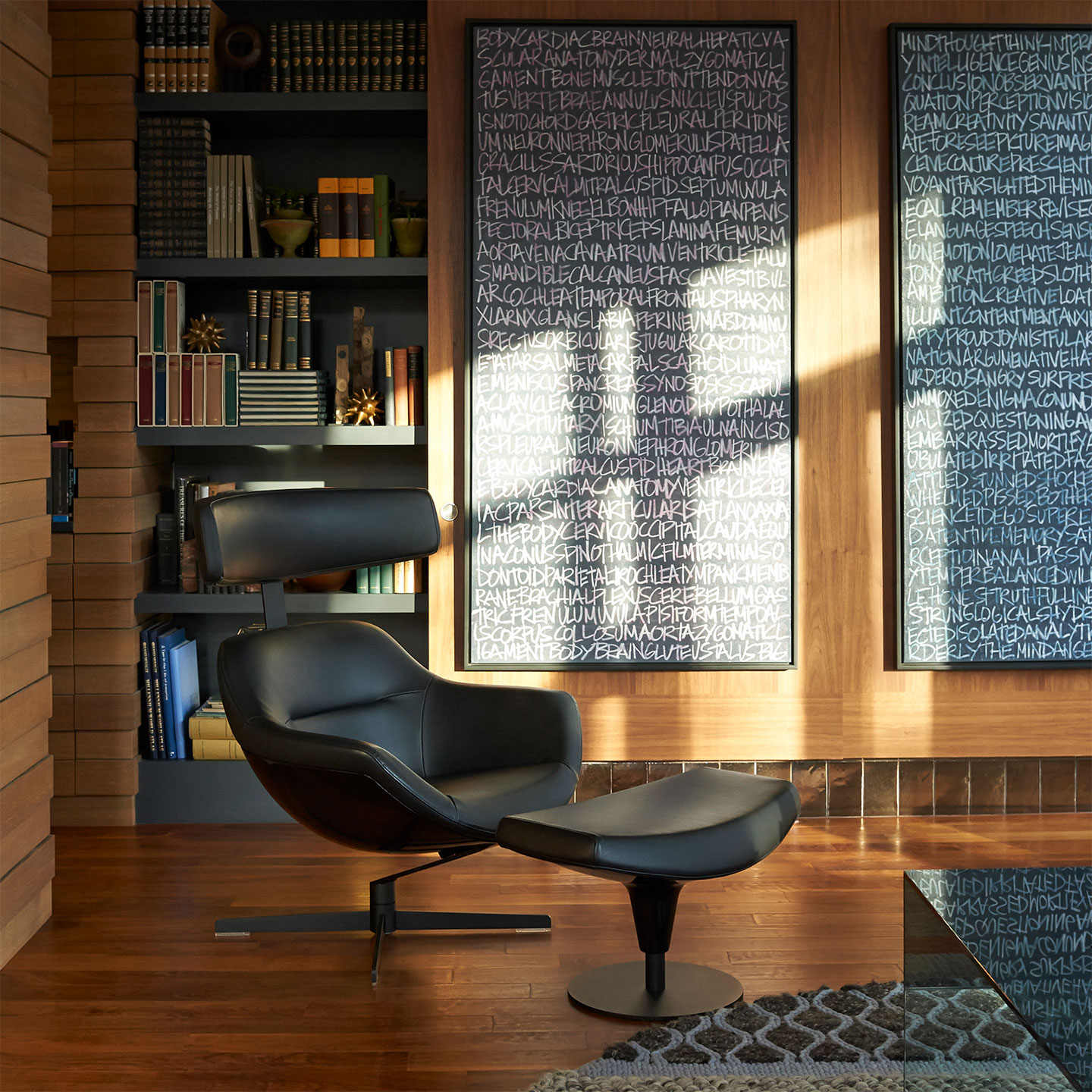 Haworth Auckland chair with ottoman in black leather in a library