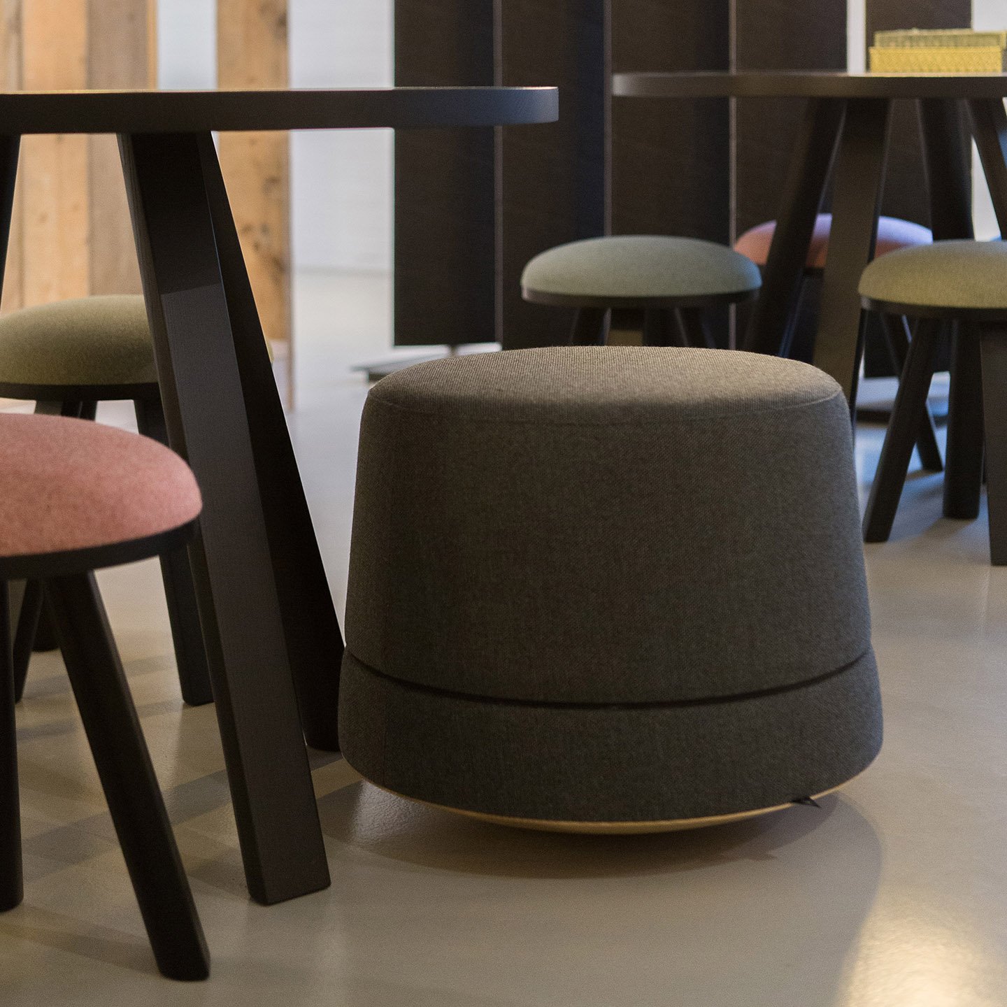 Haworth Buzzibalance poufs with Buzzimilk stools in multiple colors in a cafe