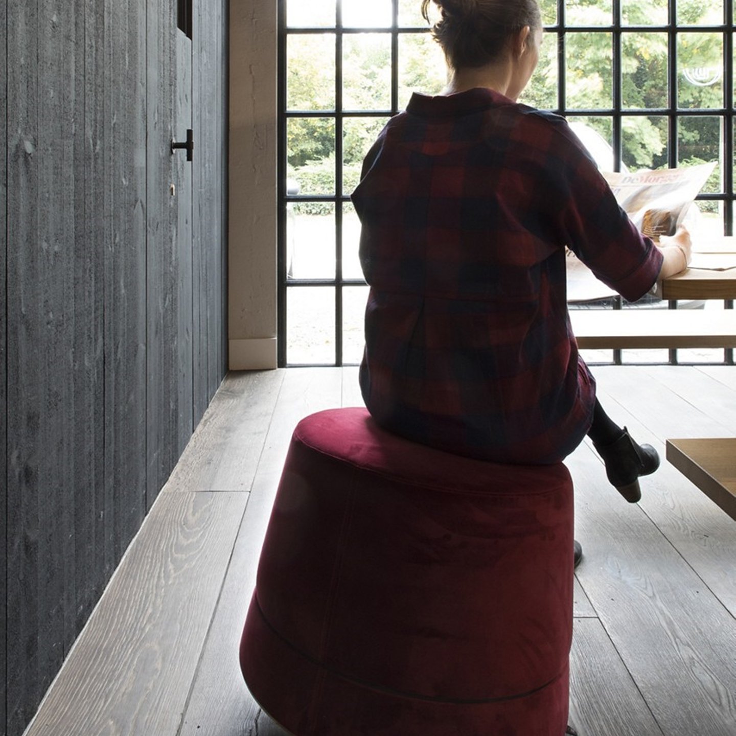 Haworth Buzzibalance pouf in red color at a cafe with movement activator and acoustic performance features