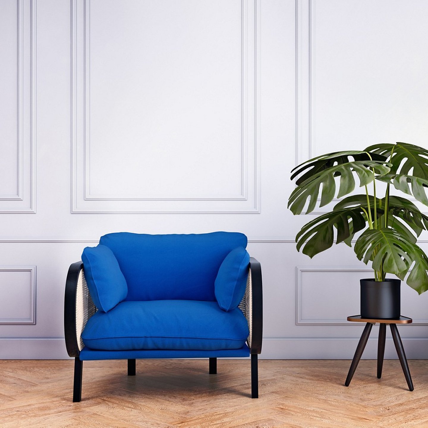Haworth Buzzicane lounge chair in blue color in a lobby area next to a potted plant