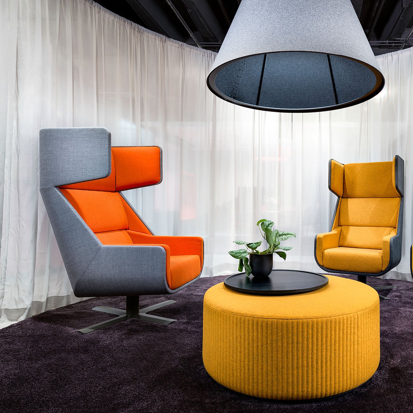 Haworth Buzzime chairs in orange, yellow and grey in a waiting area