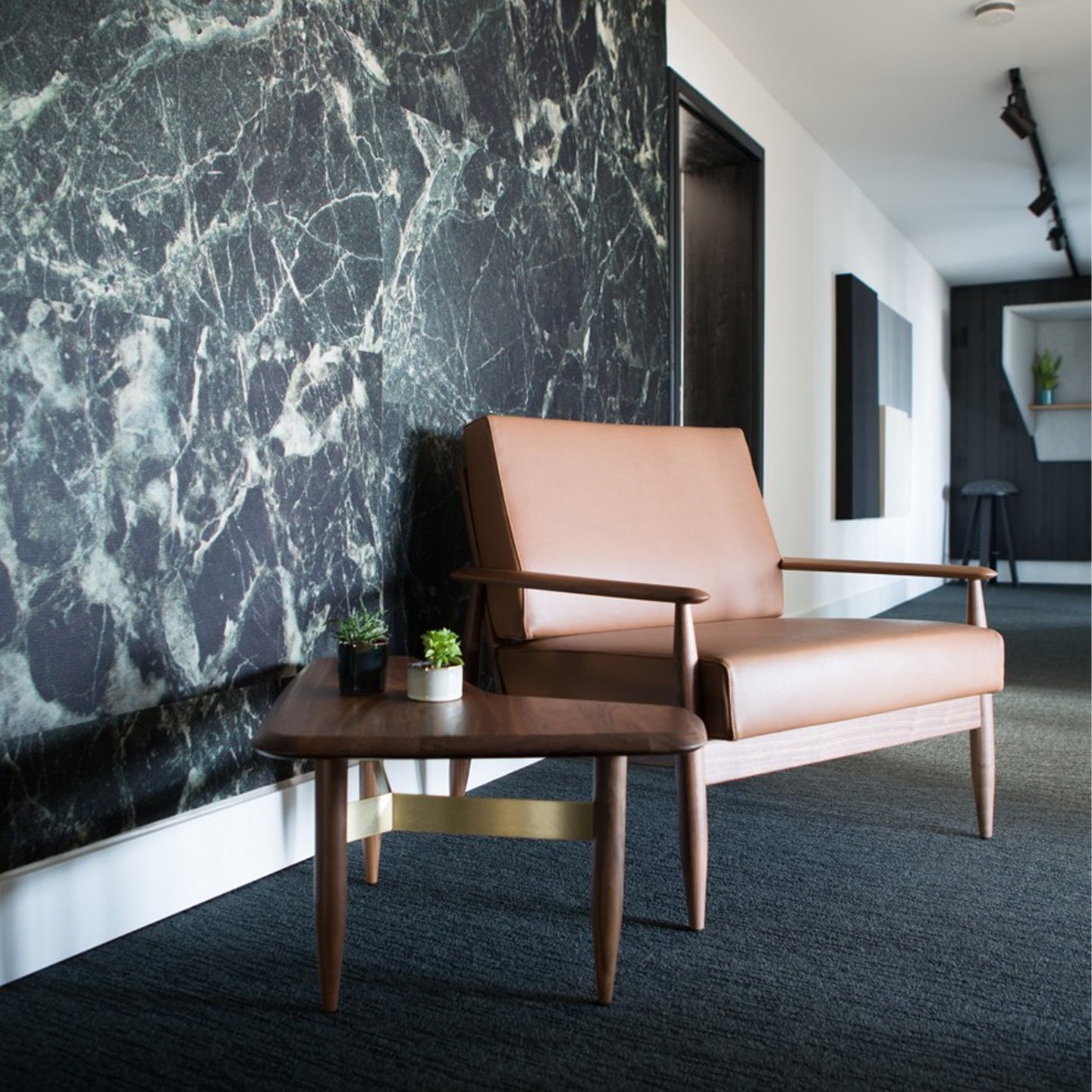 Haworth Buzzi Nordic ST100 lounge sofa in tan leather in a lobby