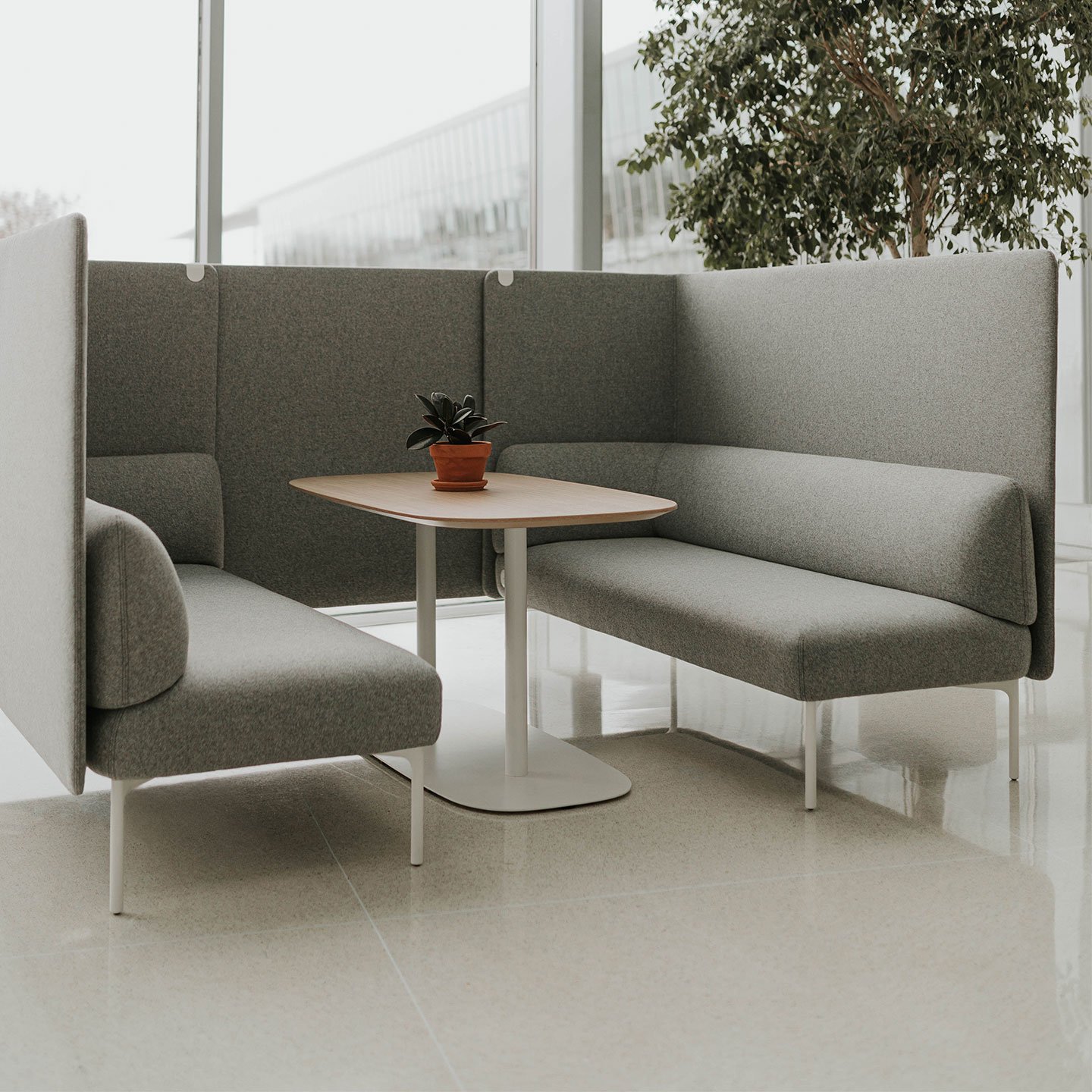Haworth Cabana lounge connector screen in green in a office reception area