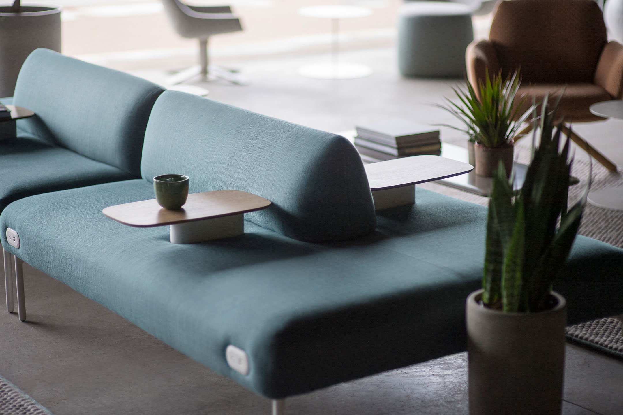 Haworth Cabana island lounge in green color in a hotel lobby