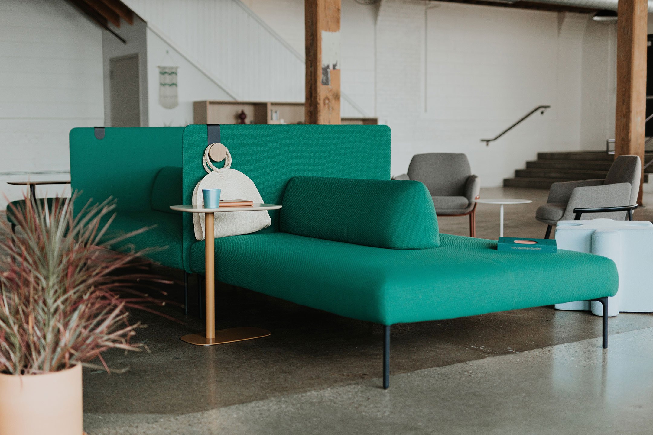 Haworth Cabana island lounge in green color in an open office lobby area