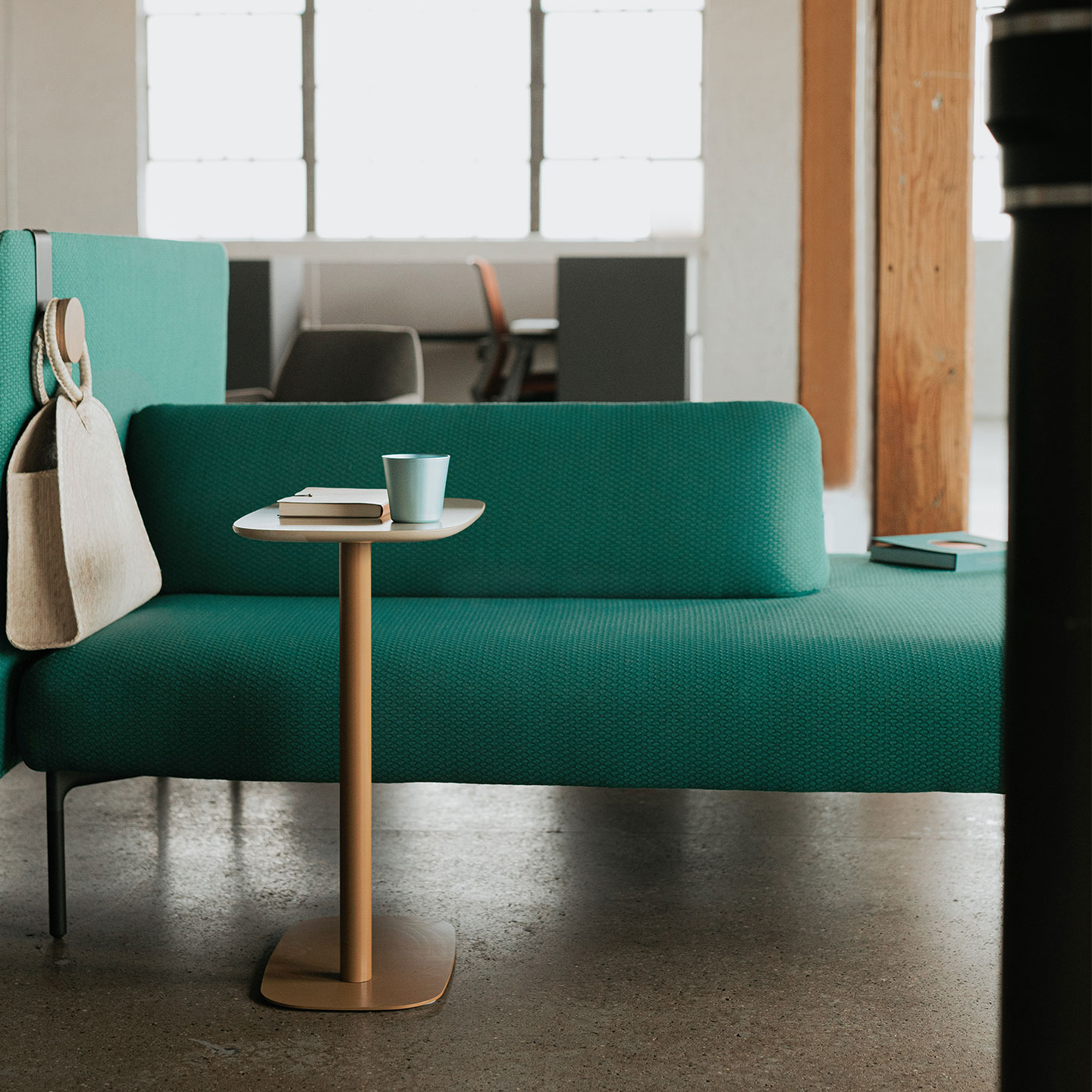 Haworth Cabana lounge island in green color with freestanding table, bag holder showcasing the features of the lounge