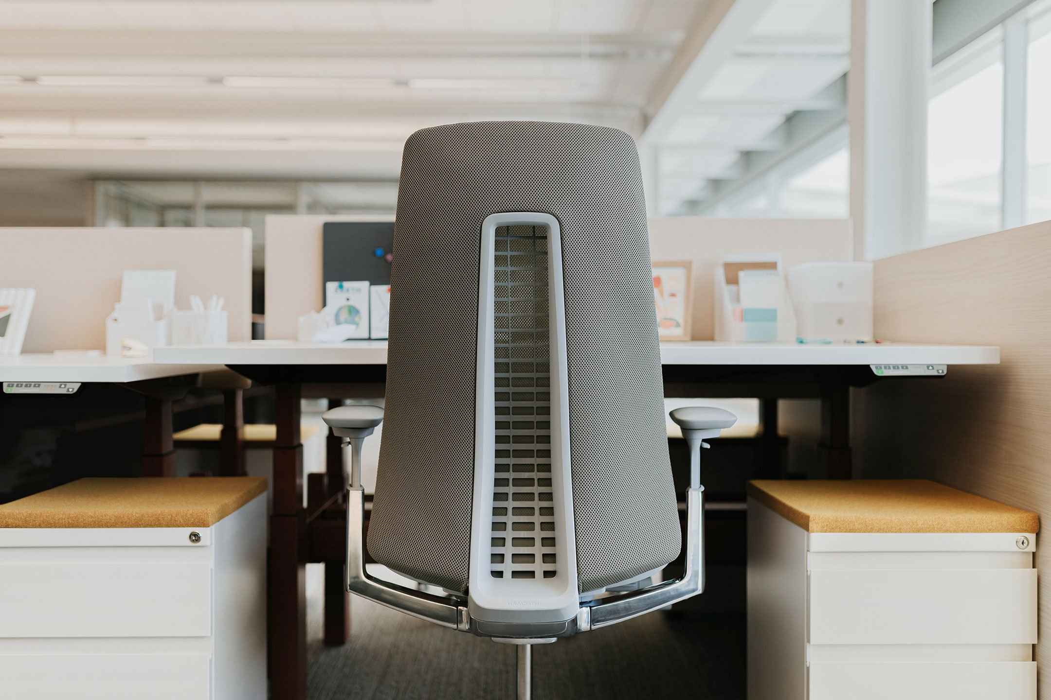 Haworth Fern Task chair in light grey upholstery at a workstation in a office room