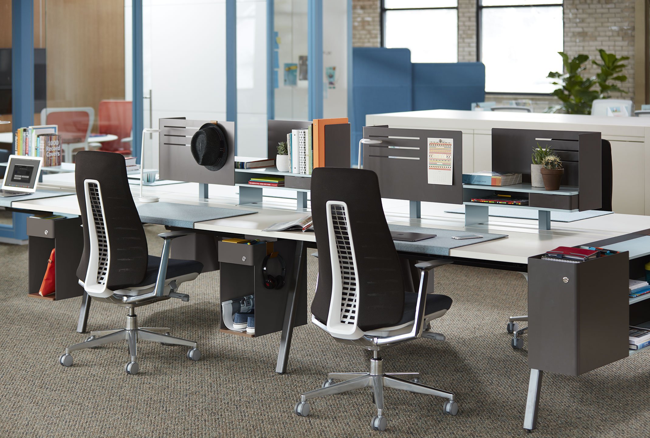 Haworth Fern task chairs in black upholstery placed in a serial workstation space on a office floor