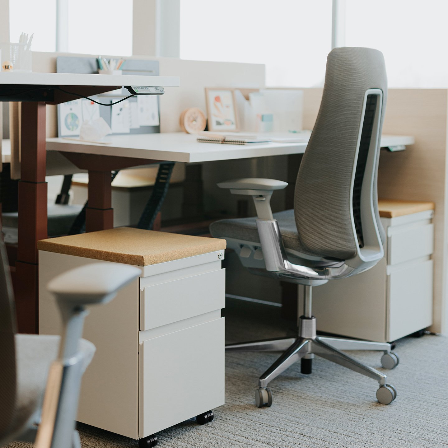 Haworth Fern desk chair in grey upholstery with Planes desk in a office space