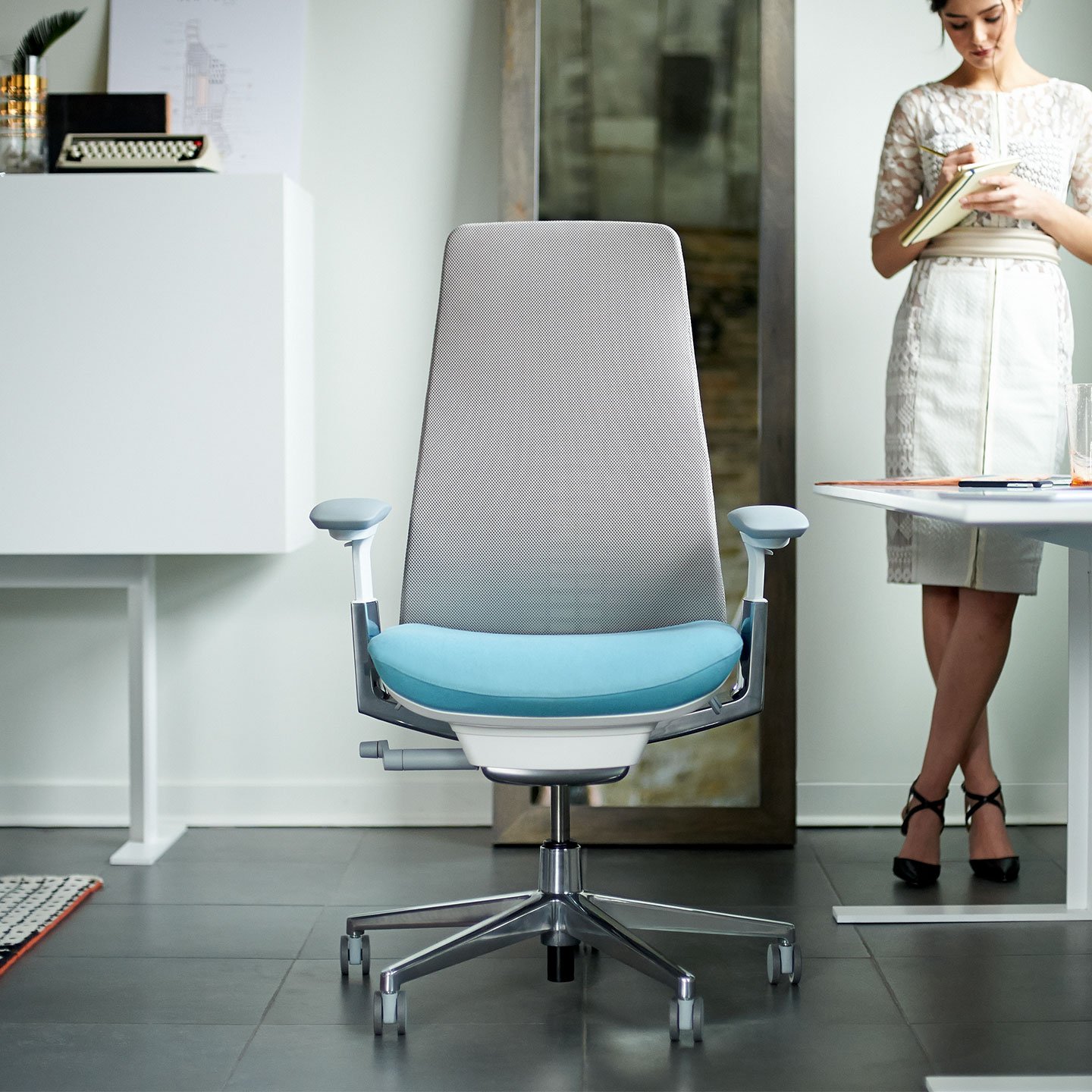 Haworth Fern task chair in grey and blue color in a office space
