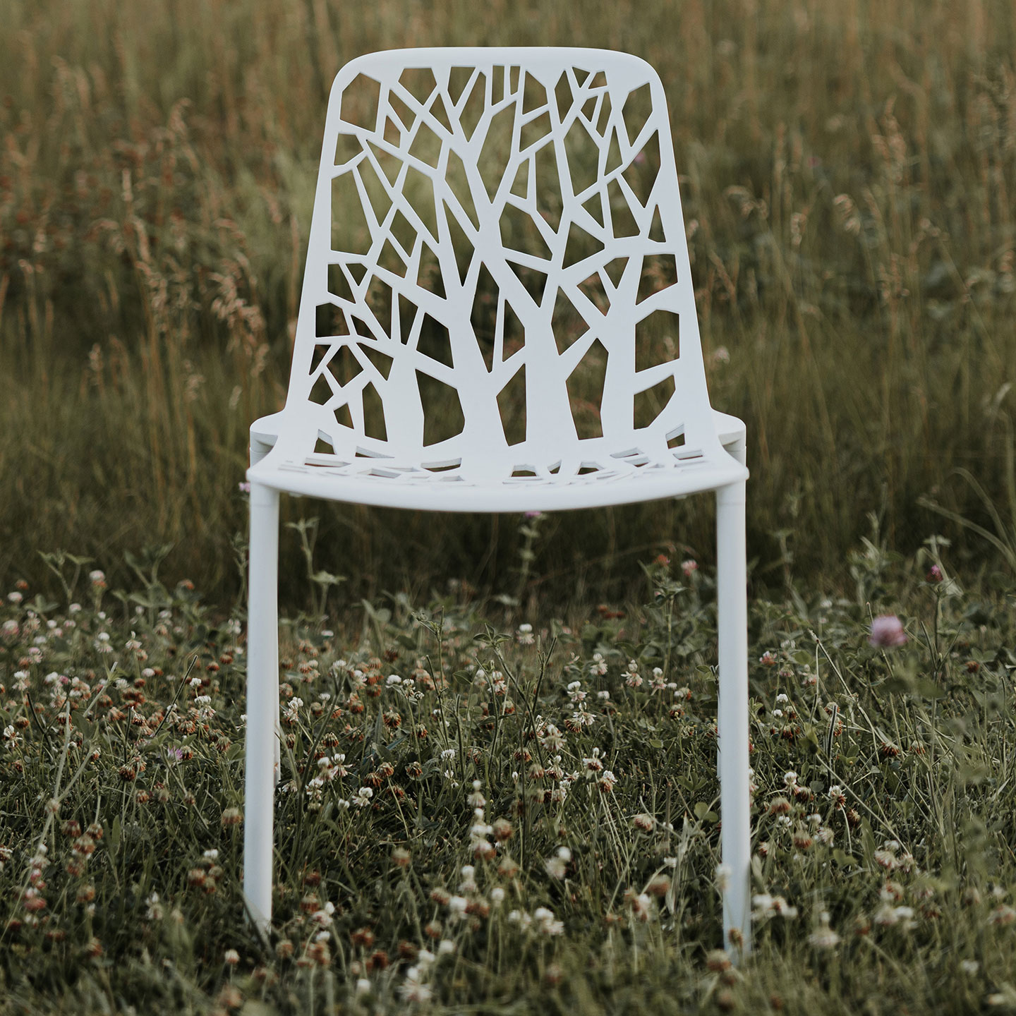 Haworth Forest chair in white in a field amidst nature