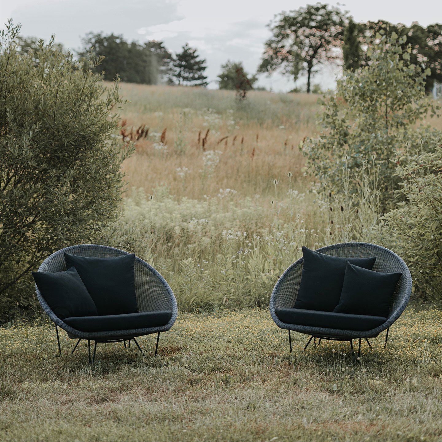 Haworth Gigi II lounge chairs in a field amidst nature