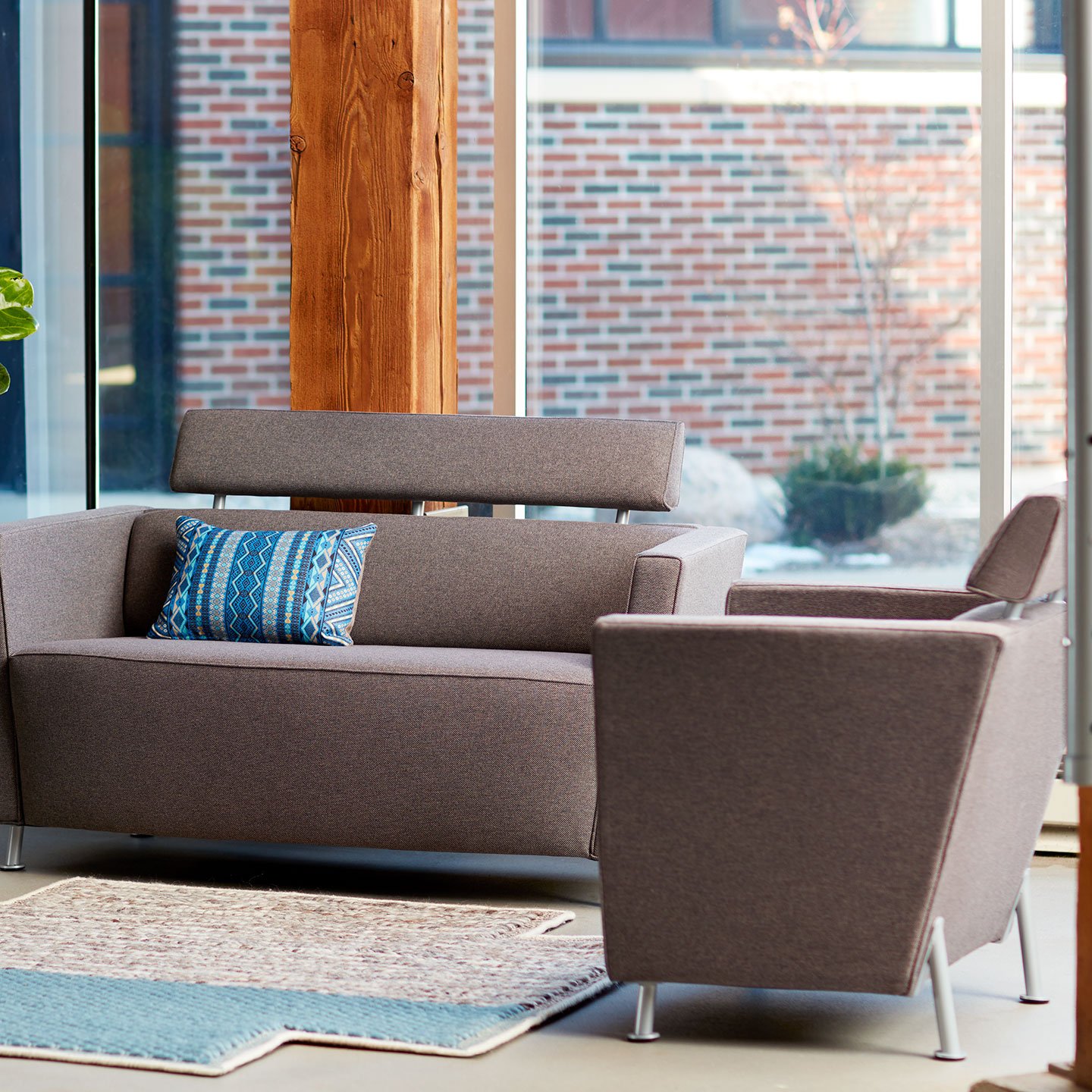 Haworth Hello lounge sofa in brown upholstery with Gan rug in a casual space