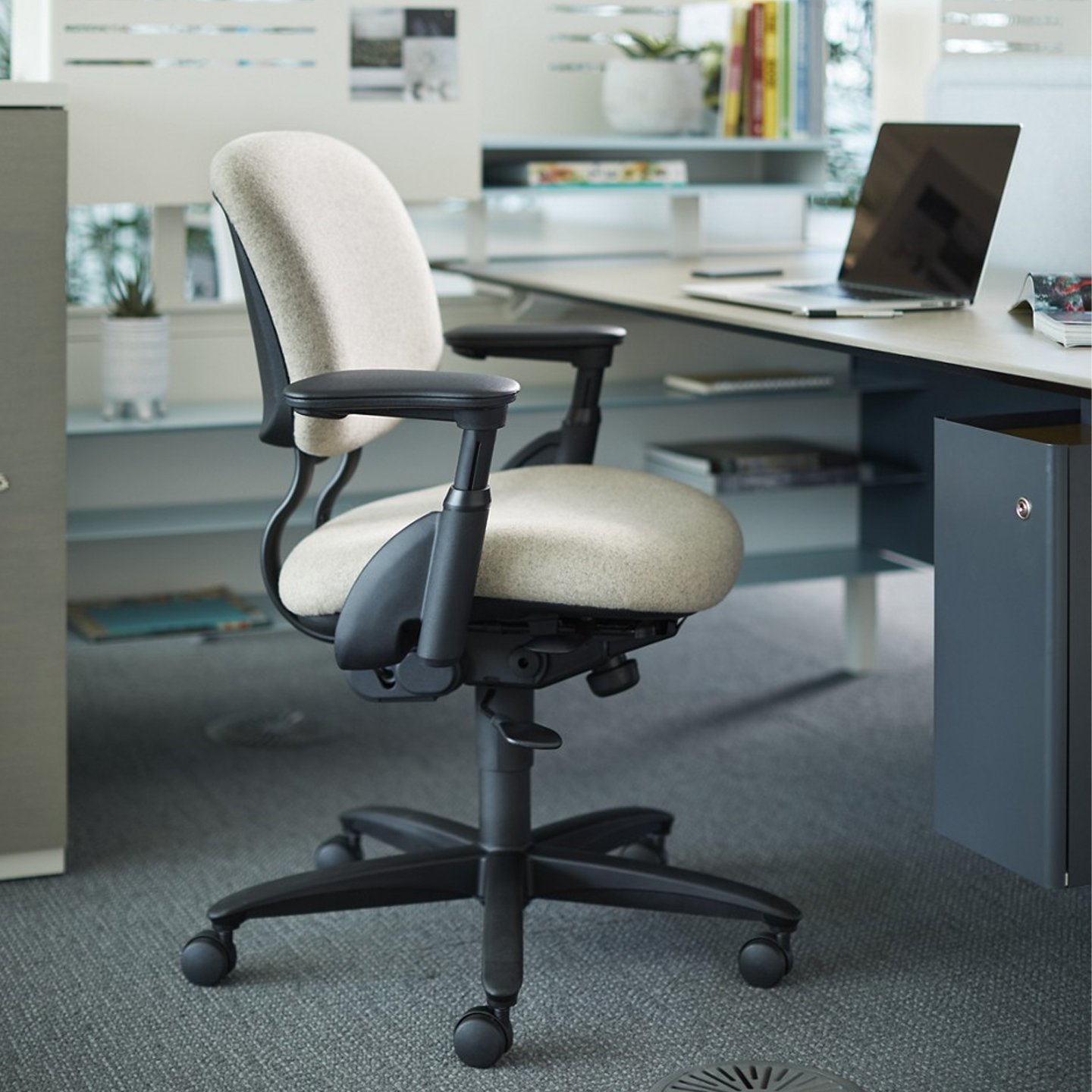 Haworth Improv H E desk chair in beige upholstery at a workstation