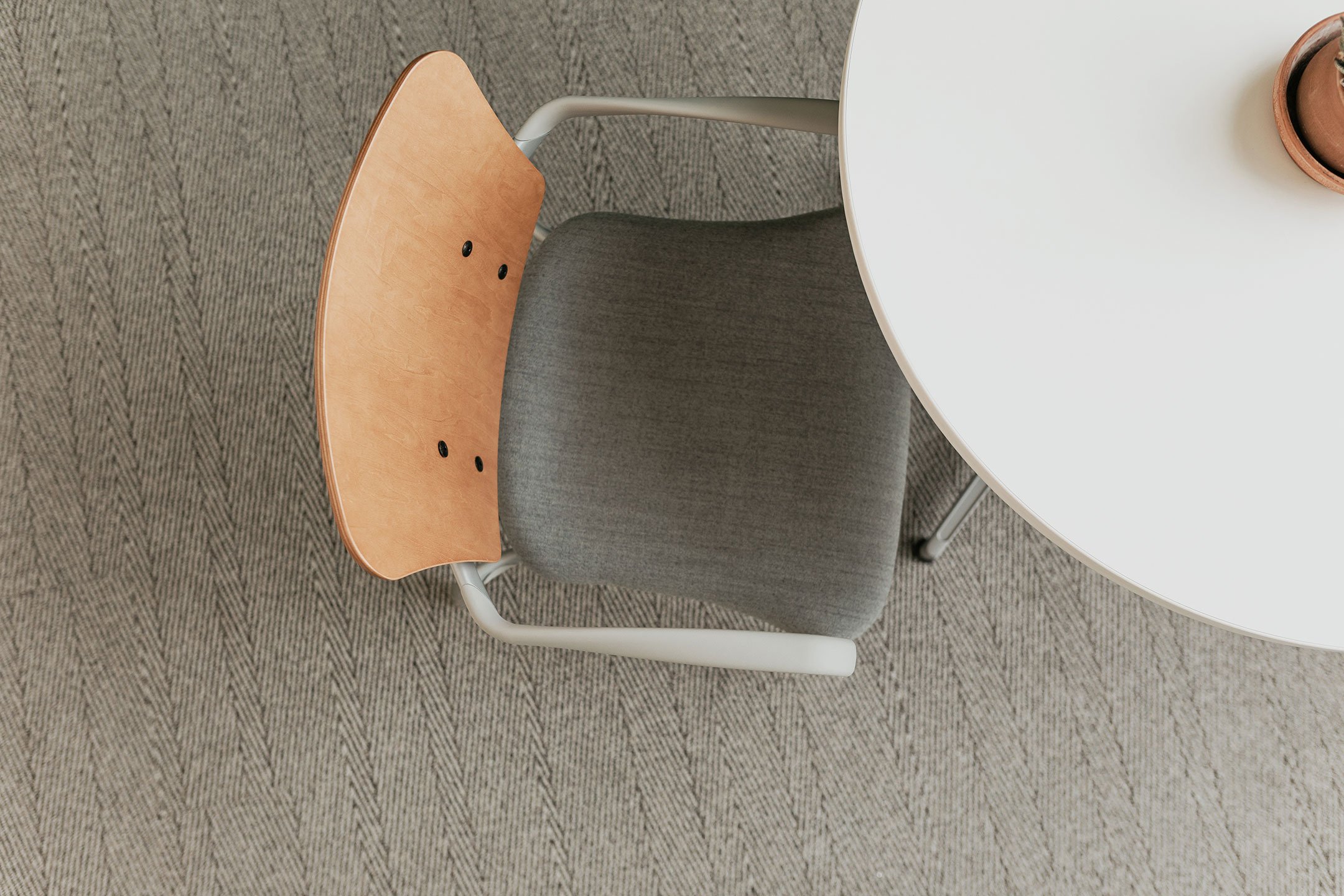 Haworth Improv Side chair in grey upholstery and wooden back top view