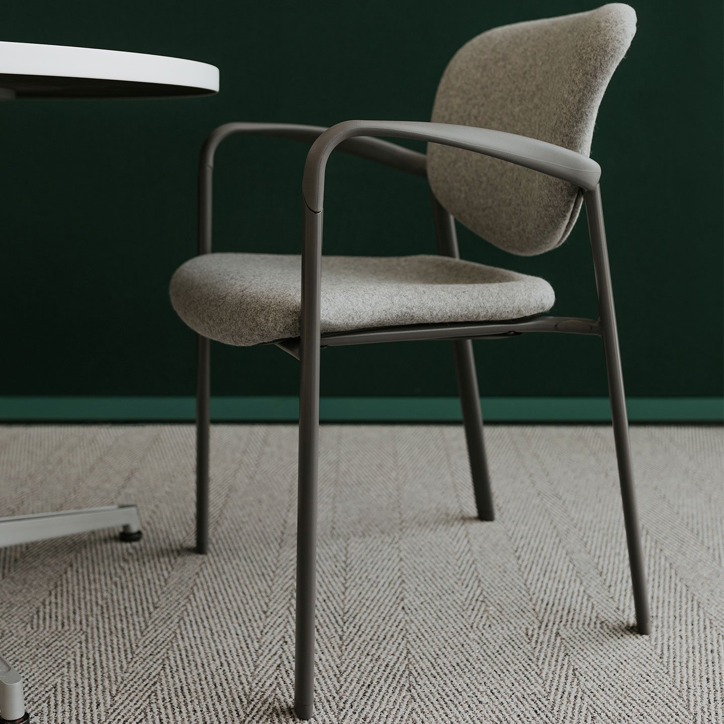 Haworth Improv Side chair in grey upholstery in a side view