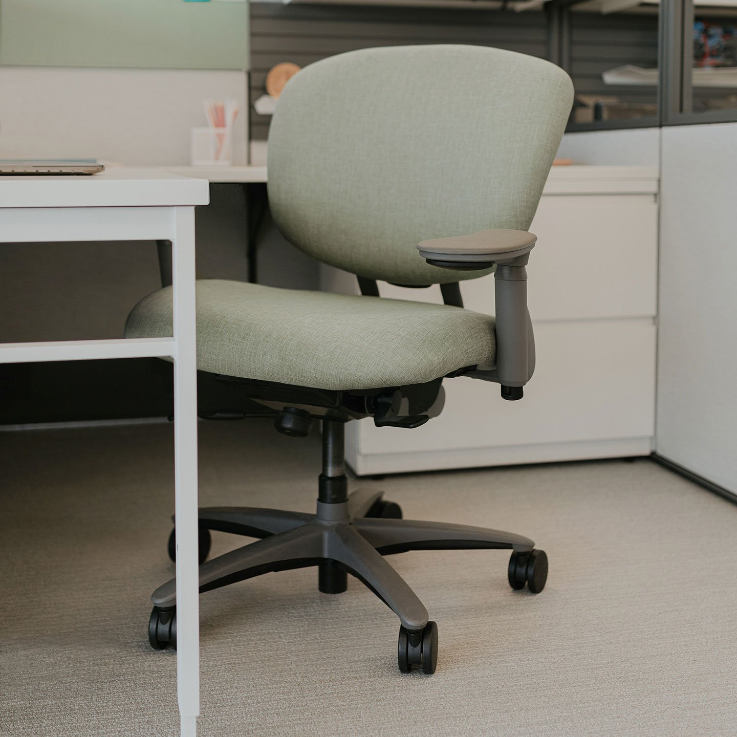 Haworth Improv XL desk chair in olive green upholstery at a workstation