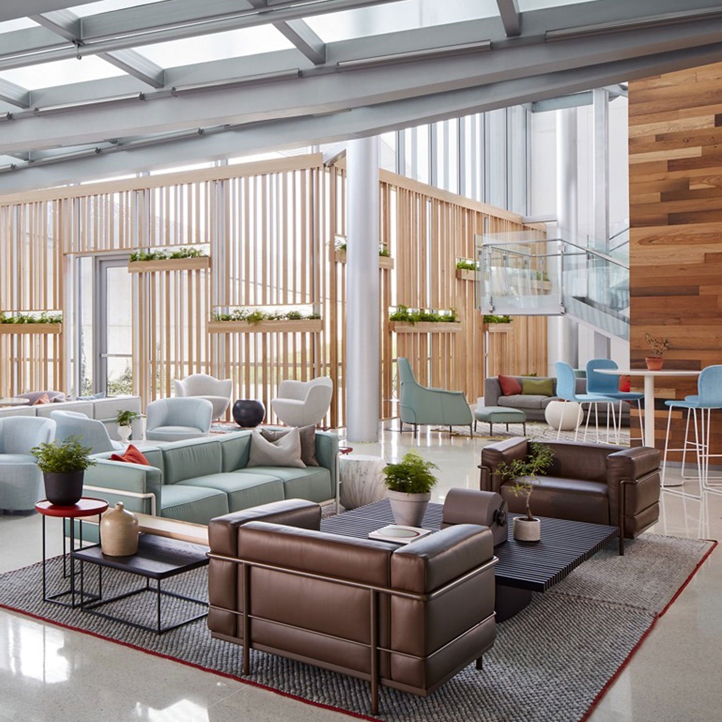 Haworth LC3 lounge chair in brown leather in a office lobby