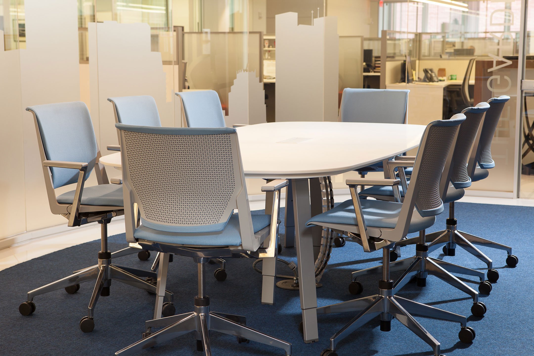 Gray and blue Very Conference chairs in conference room