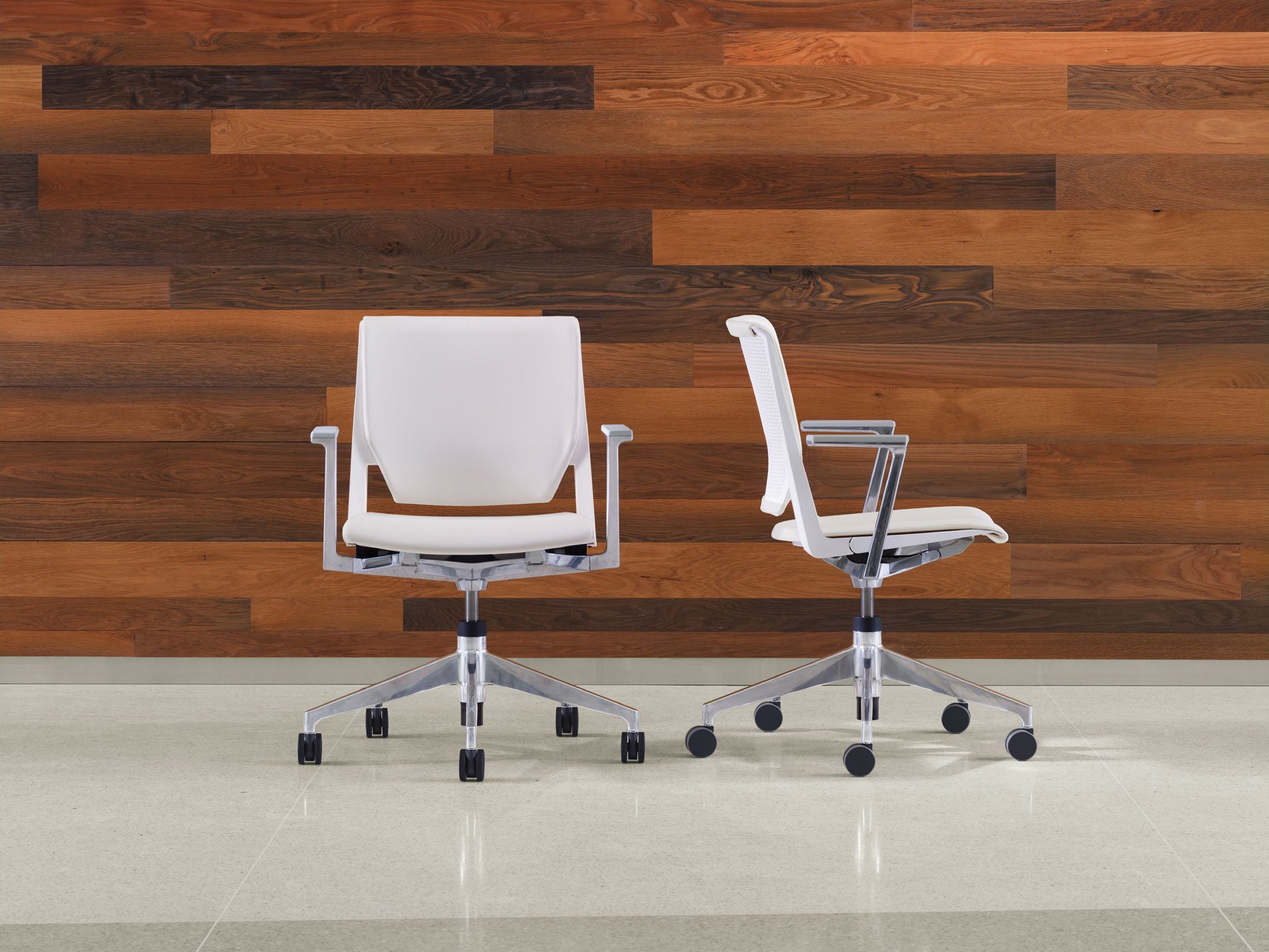 Very Conference chairs in white with chrome five star base and arms - front and side view