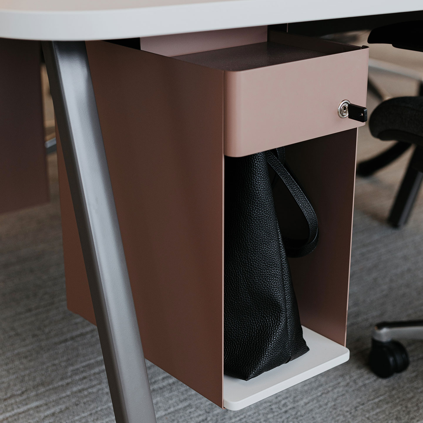 Active Components shelf and lock doors underneath individual work desk. 