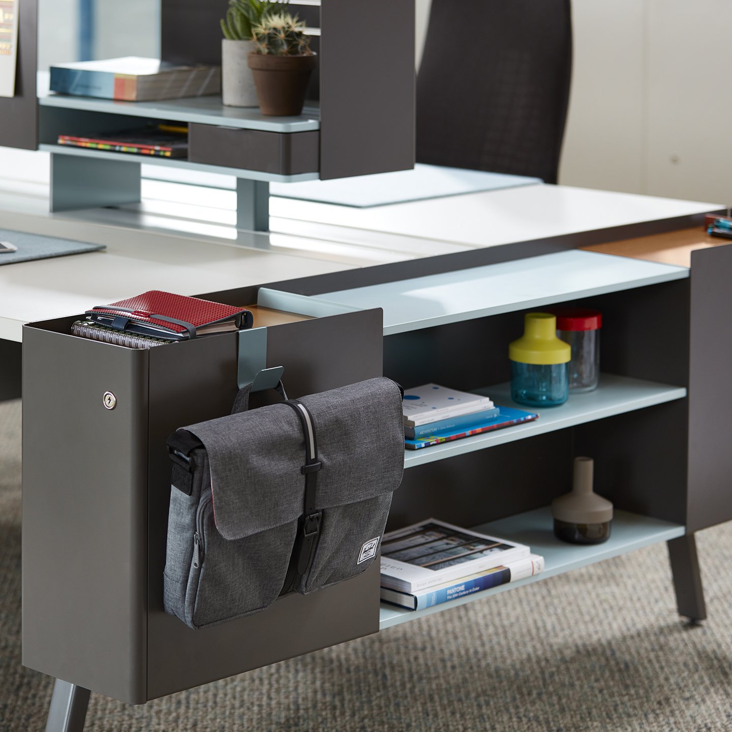 Active Components with side shelf and lock drawers in gray at work space 