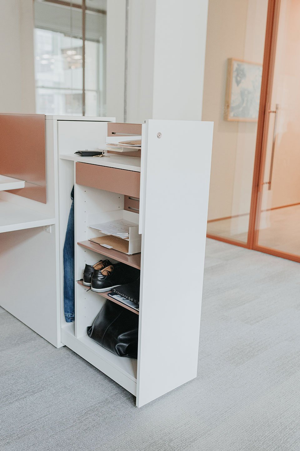 Haworth Beside storage pantry in white and peach combination inside a office 