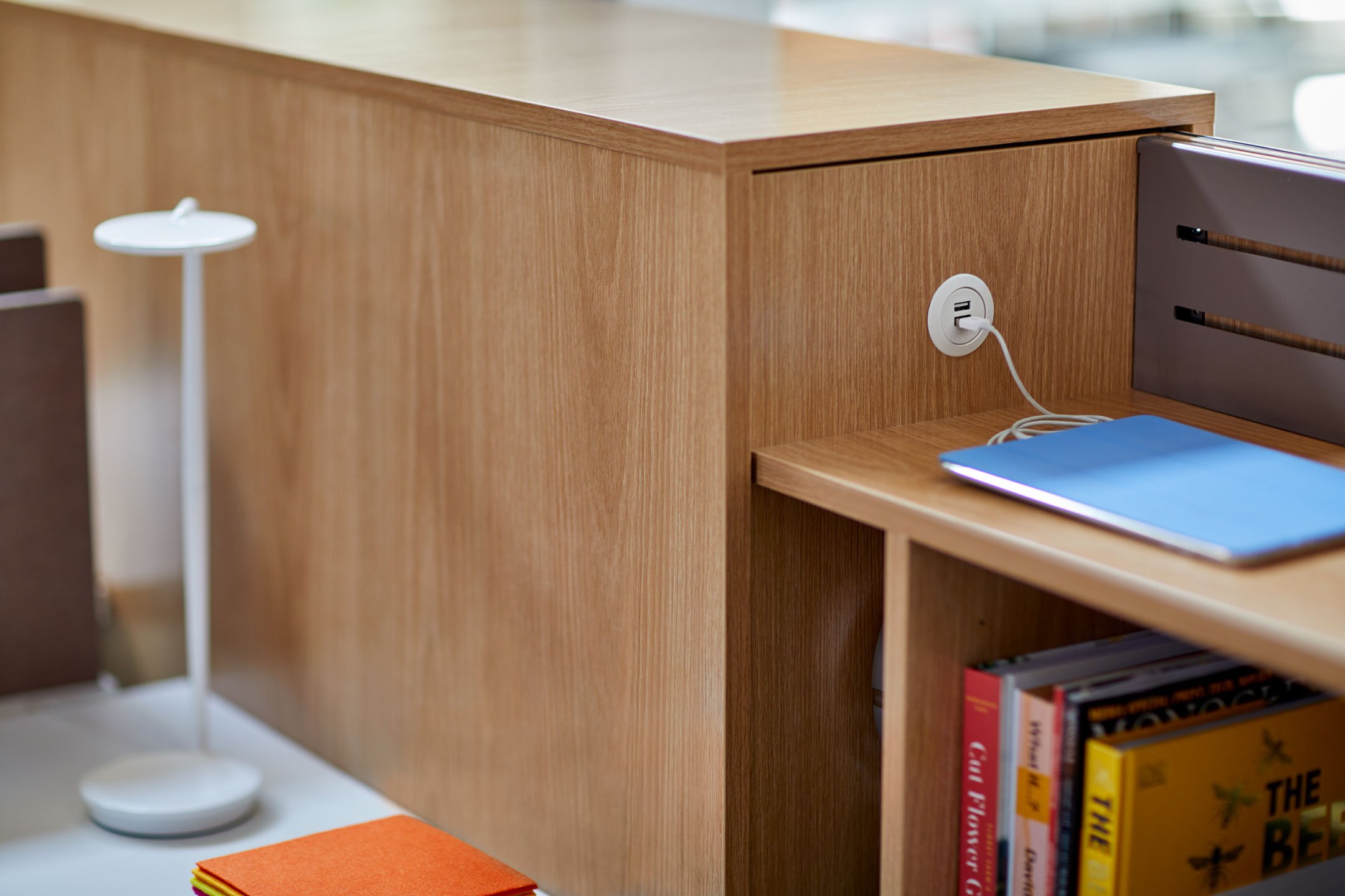 Beside wooden storage pantry with USB charging capabilities 