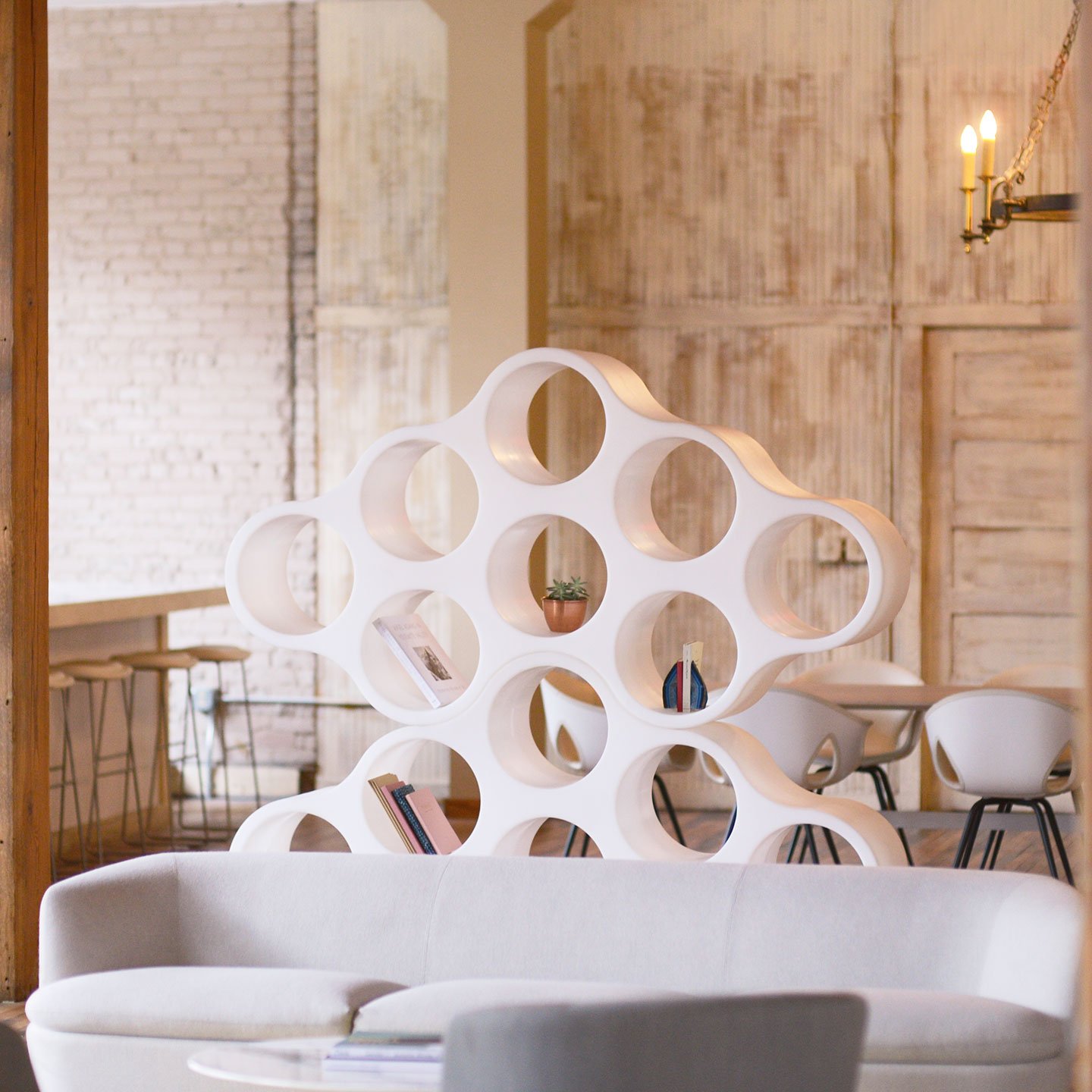 White cloud bookshelf in office lounge space.