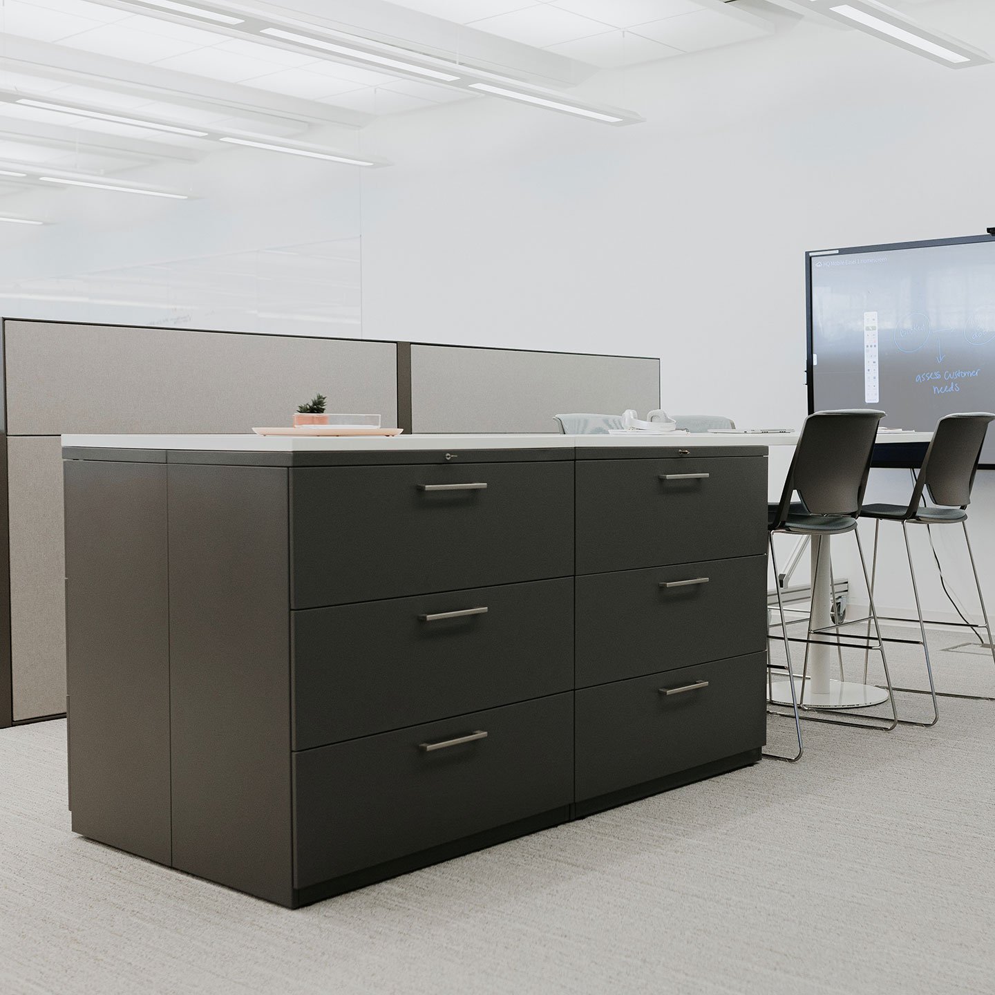 X Series storage unit with stacked drawers in black and linear drawer pulls