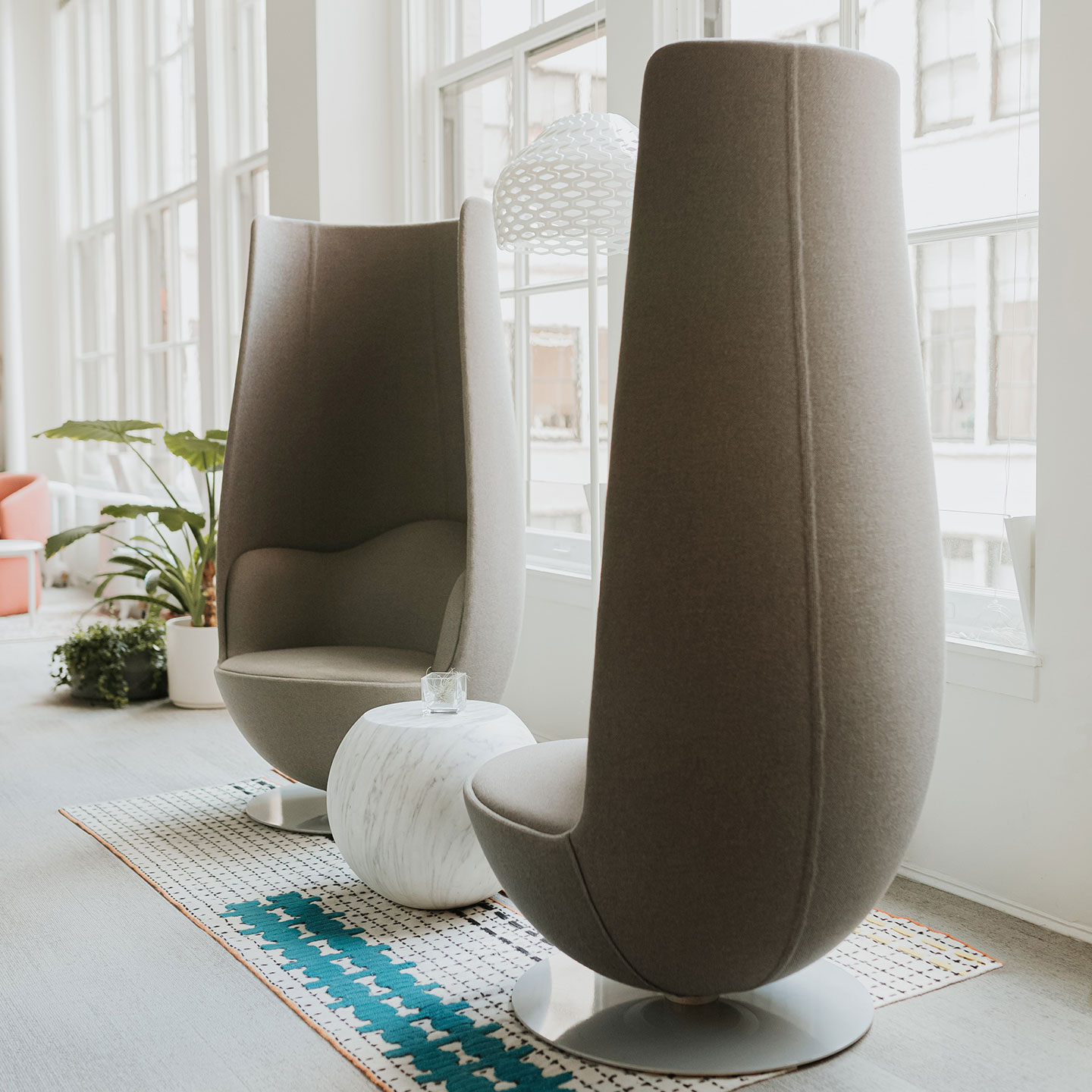 Haworth Bong Side Table in marble white next to conversation area