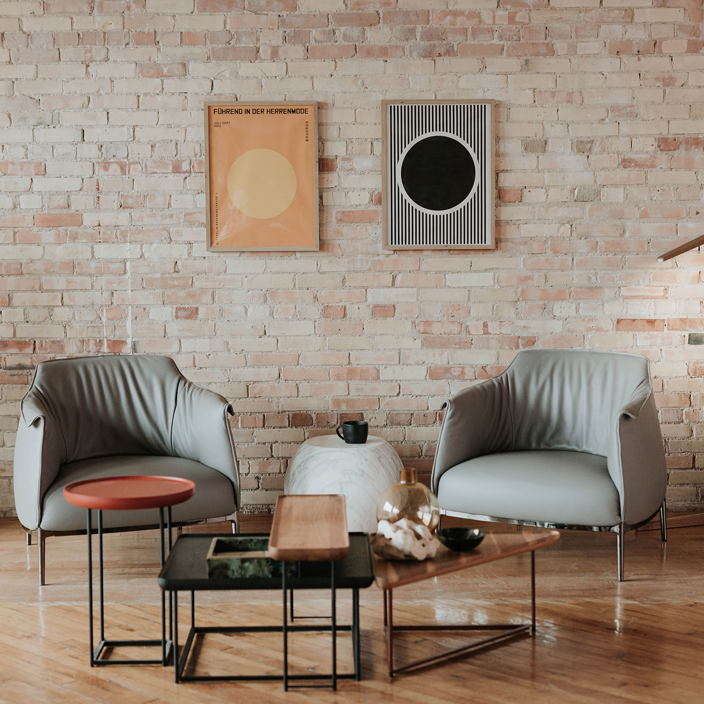 Haworth Bong side table in marble white as center table in casual conversation area with archibald  lounge chair