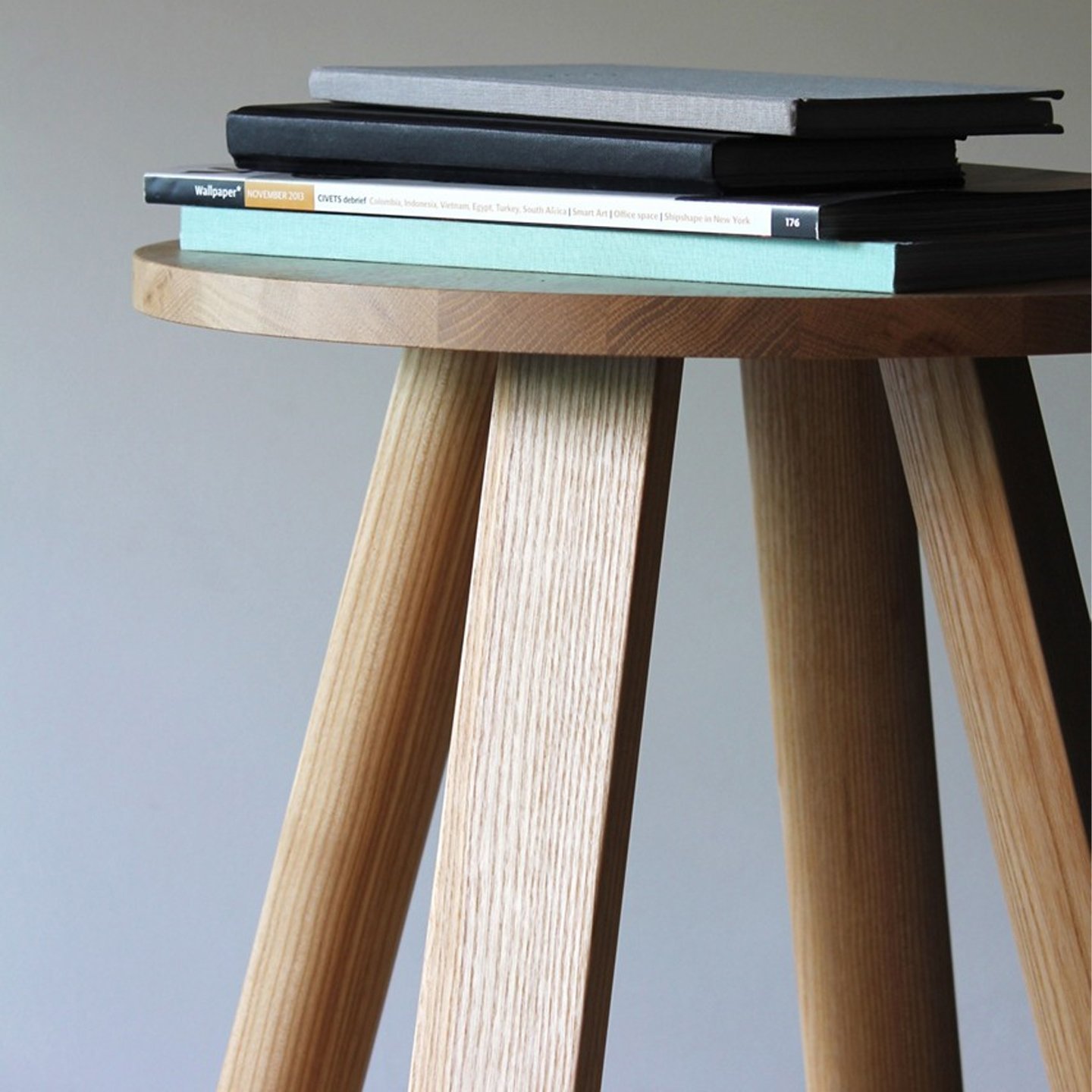 Haworth BuzziMilk table circular in Ash Natural used as small book table