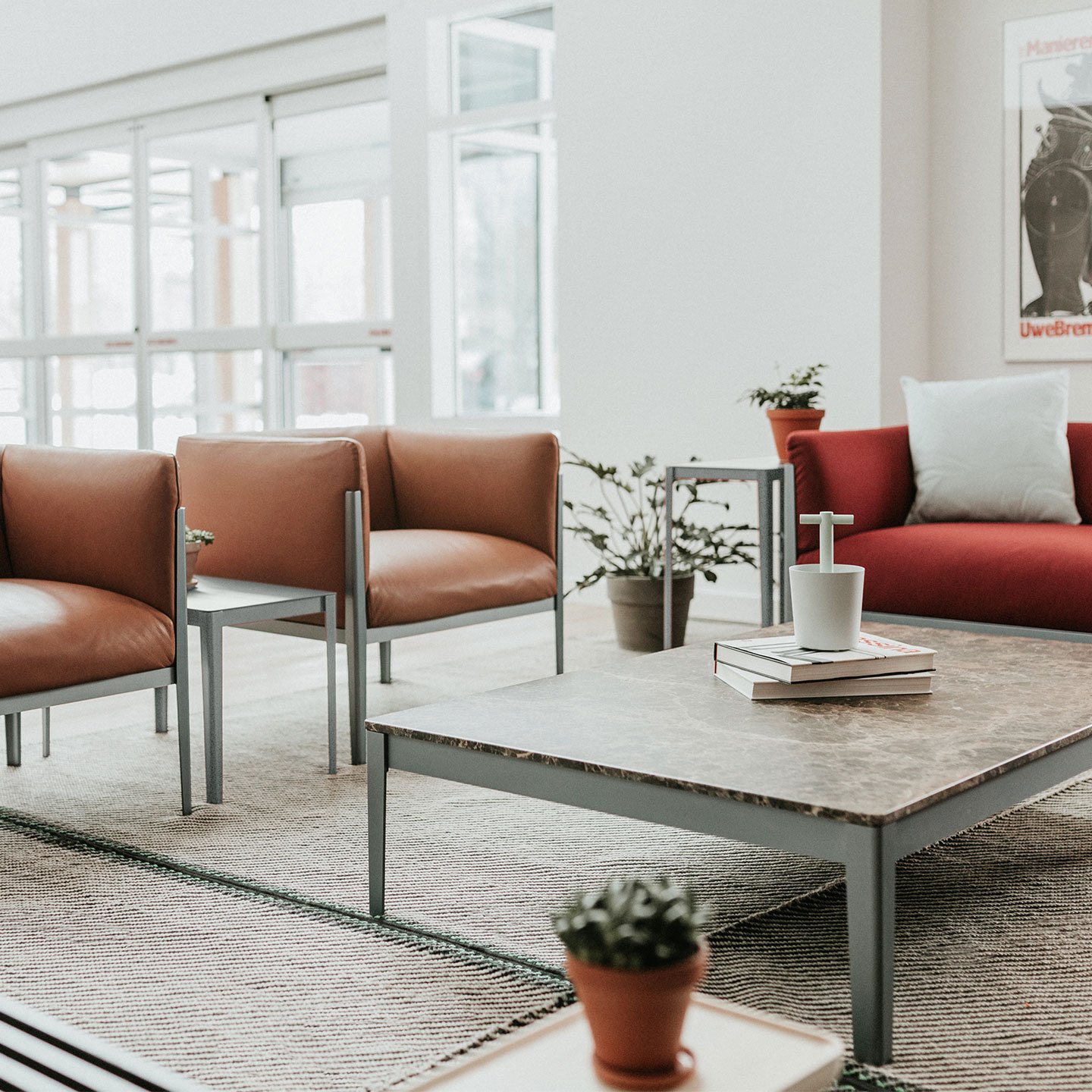 Haworth Cotone table 4 metal legs with rectangular emperado marble solid surface top in a waiting room