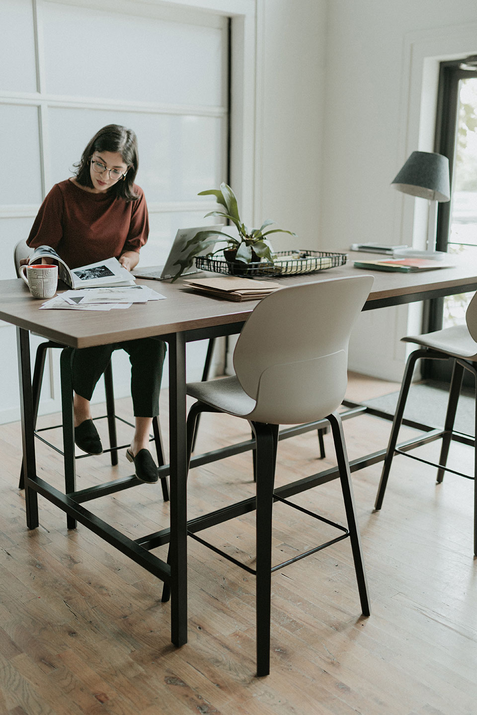 Haworth Cultivate Table with 4 black legs and veneer top as a tall work station