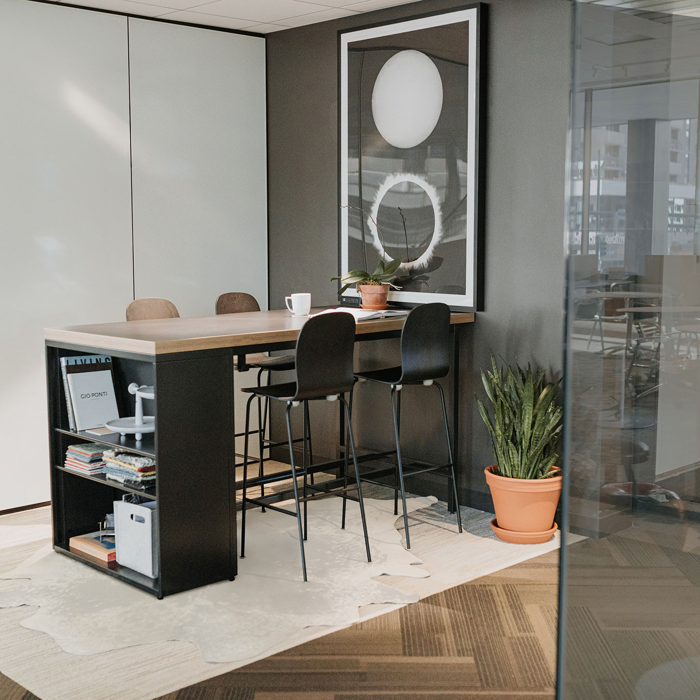 Haworth Cultivate table with rectangular veneer top in a closed off collaboration area with shelves under the table