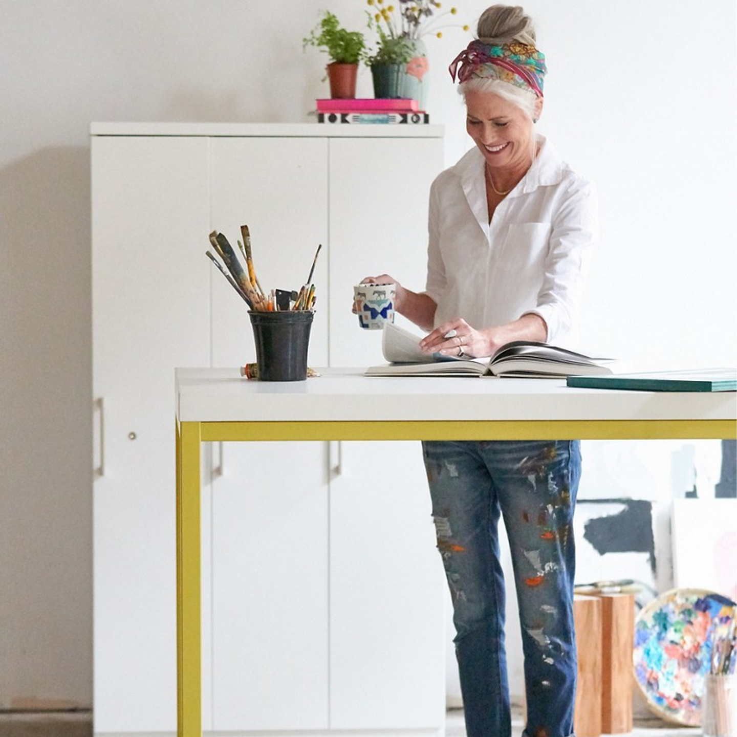 Haworth Cultivate table with 4 tall legs and laminate top in a art studio 