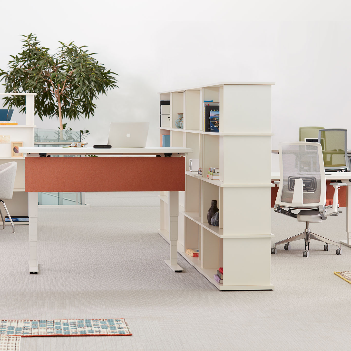 Haworth Hop Height Adjustable Table in a open office seating with Haworth chairs