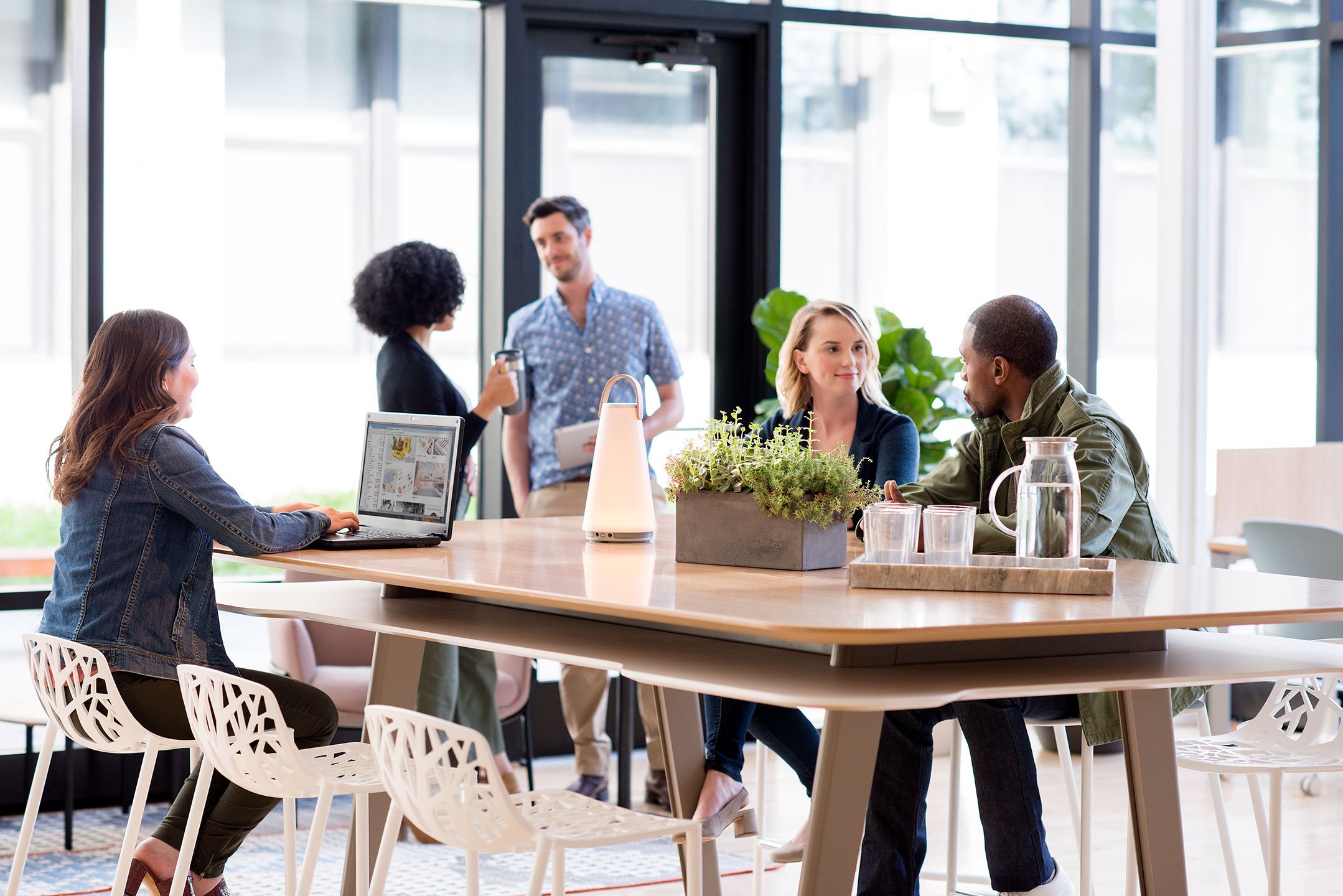 Haworth Immerse Table with wood top in a open collaboration space in an office