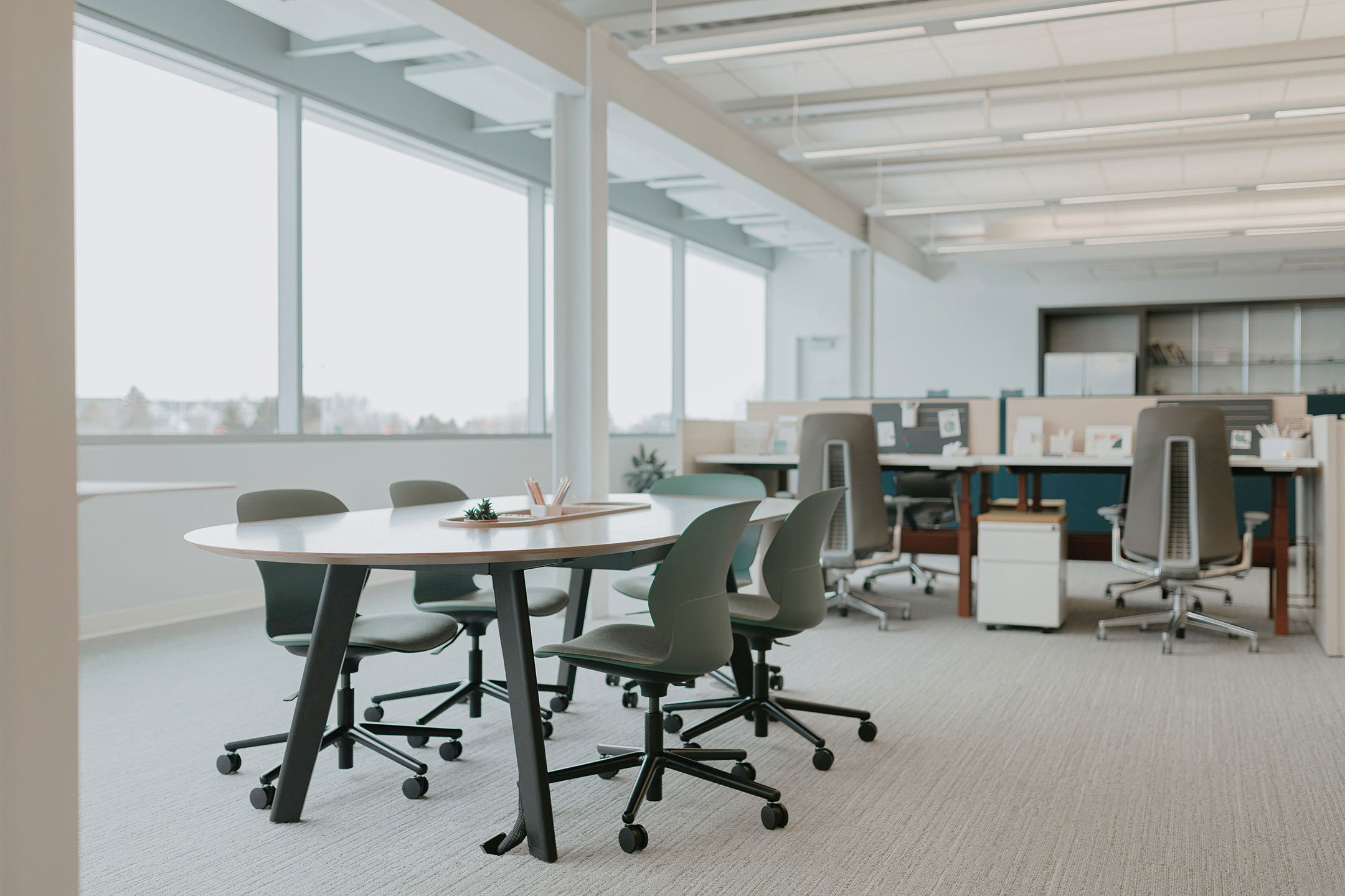 Haworth Immerse Table with elongated circular top for collaboration in open office space