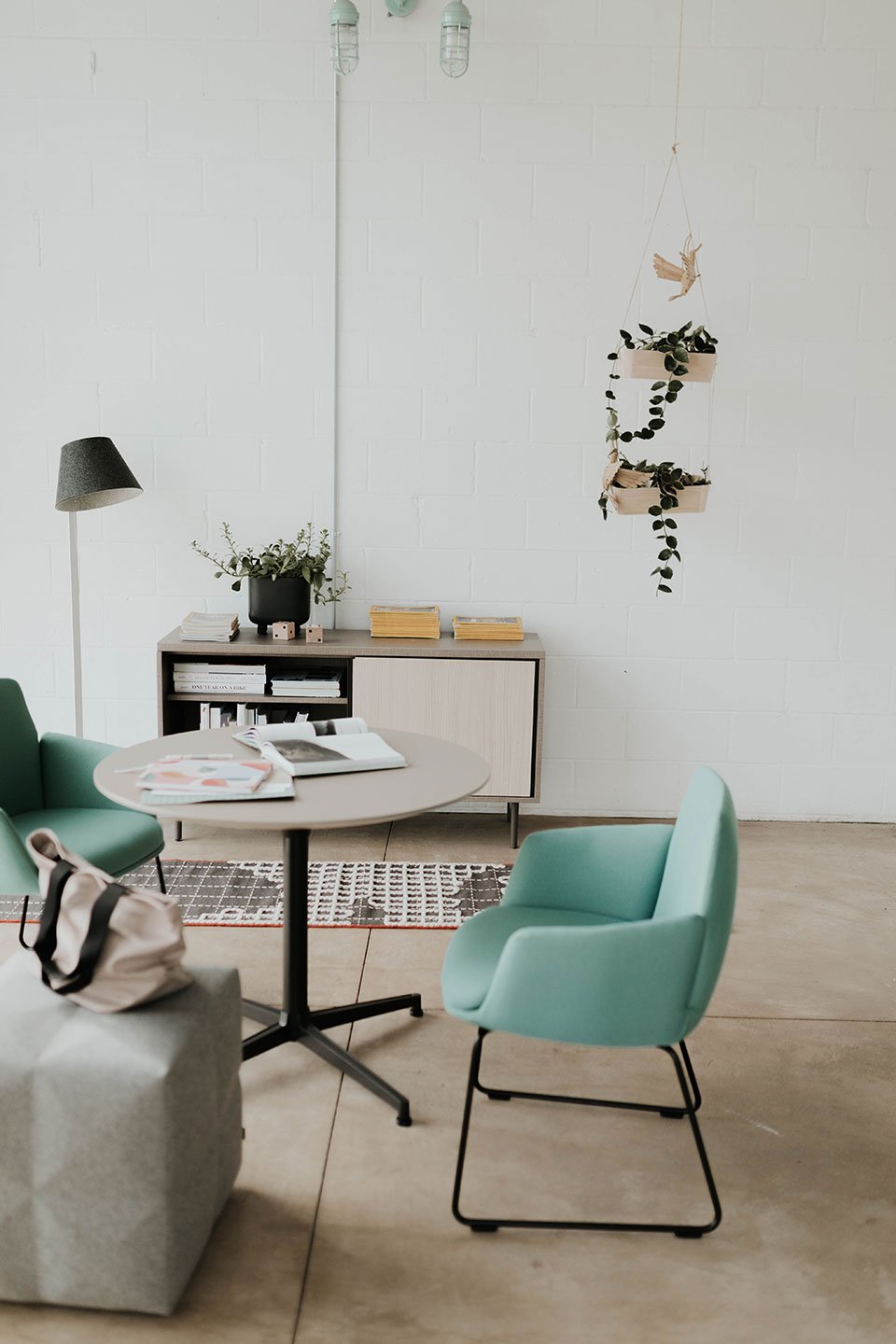 Haworth Jive Table with circular top in a small collaborative room with white décor